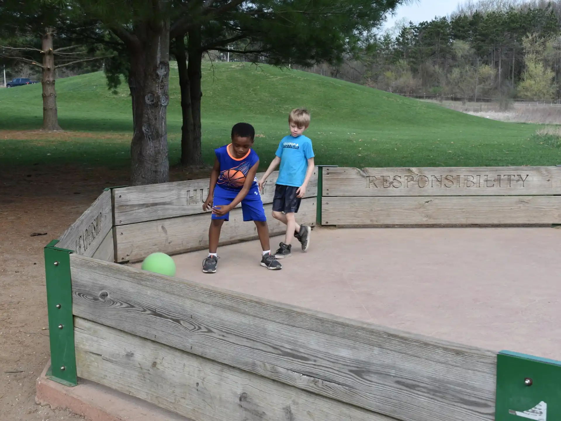 two boys playing with a ball