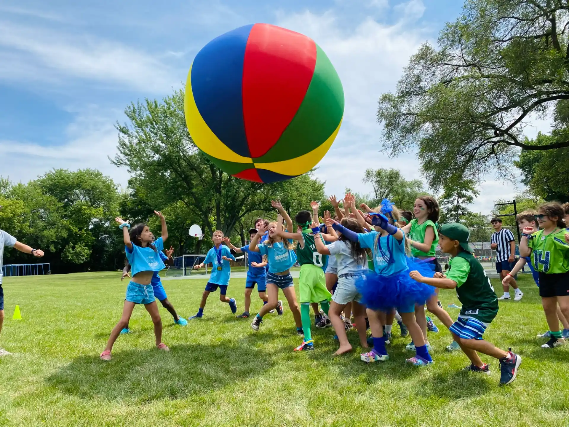 a group of people playing with a ball