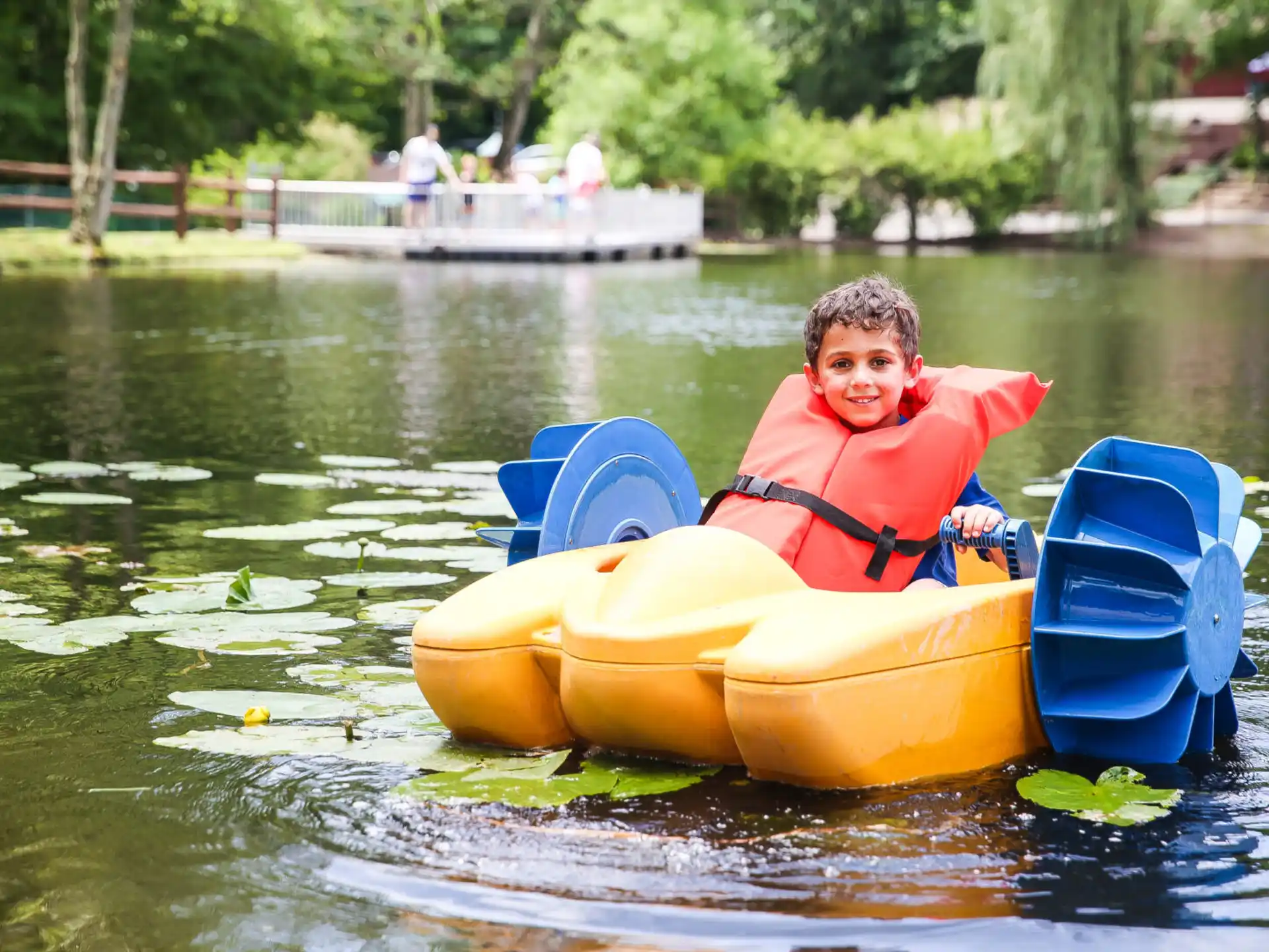 a boy in a small boat