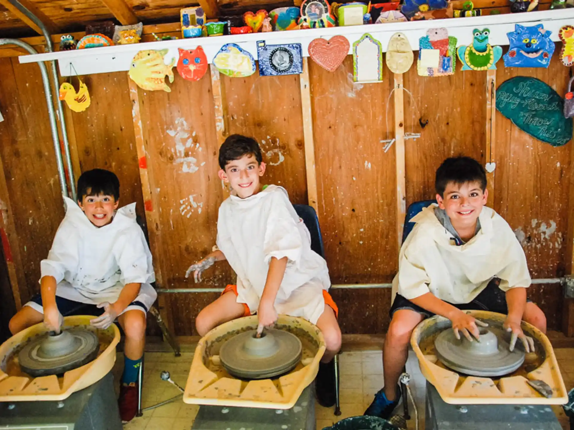 a group of boys sitting on drums