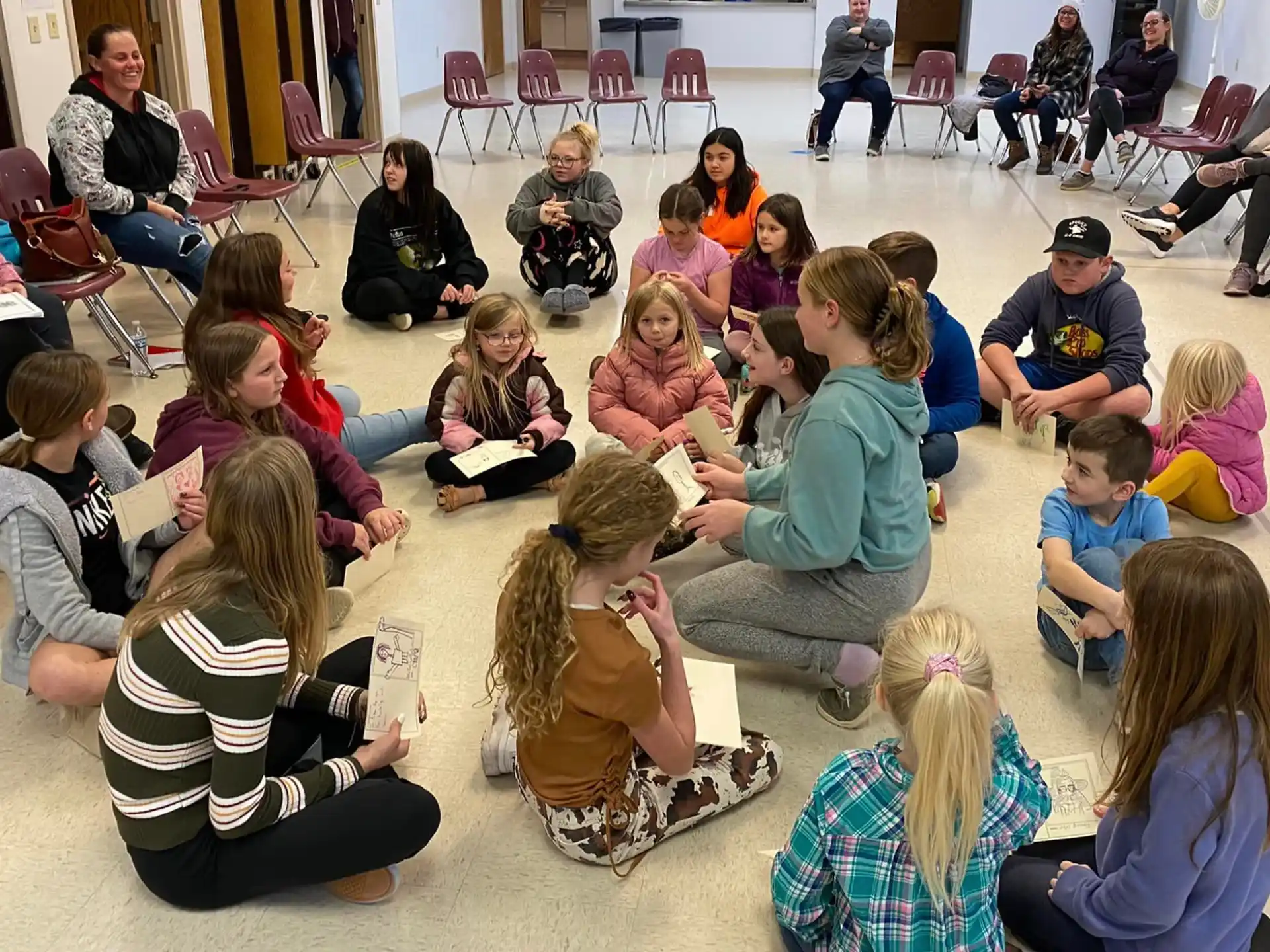 a group of people sitting on the floor