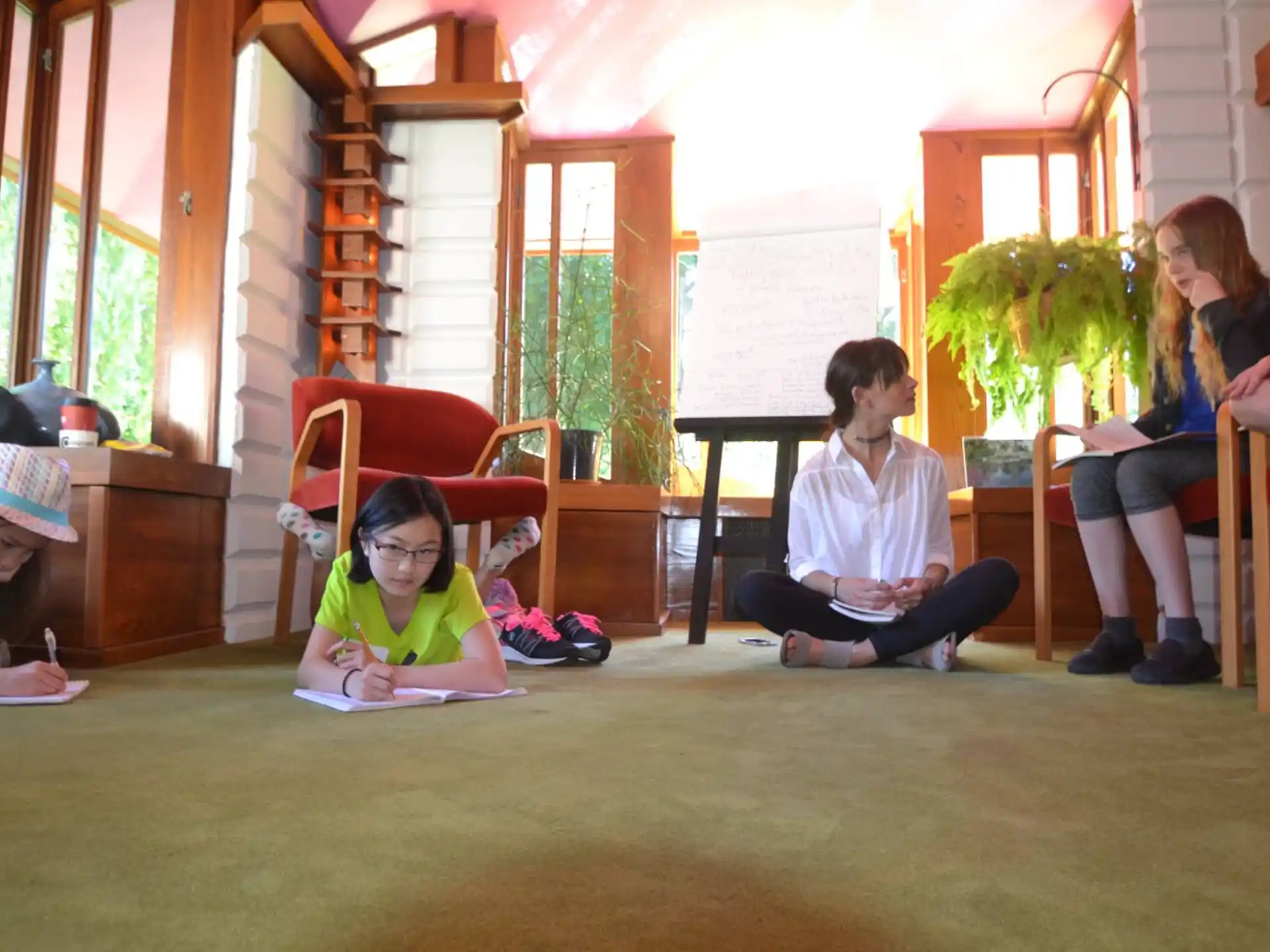 a group of children sitting in chairs