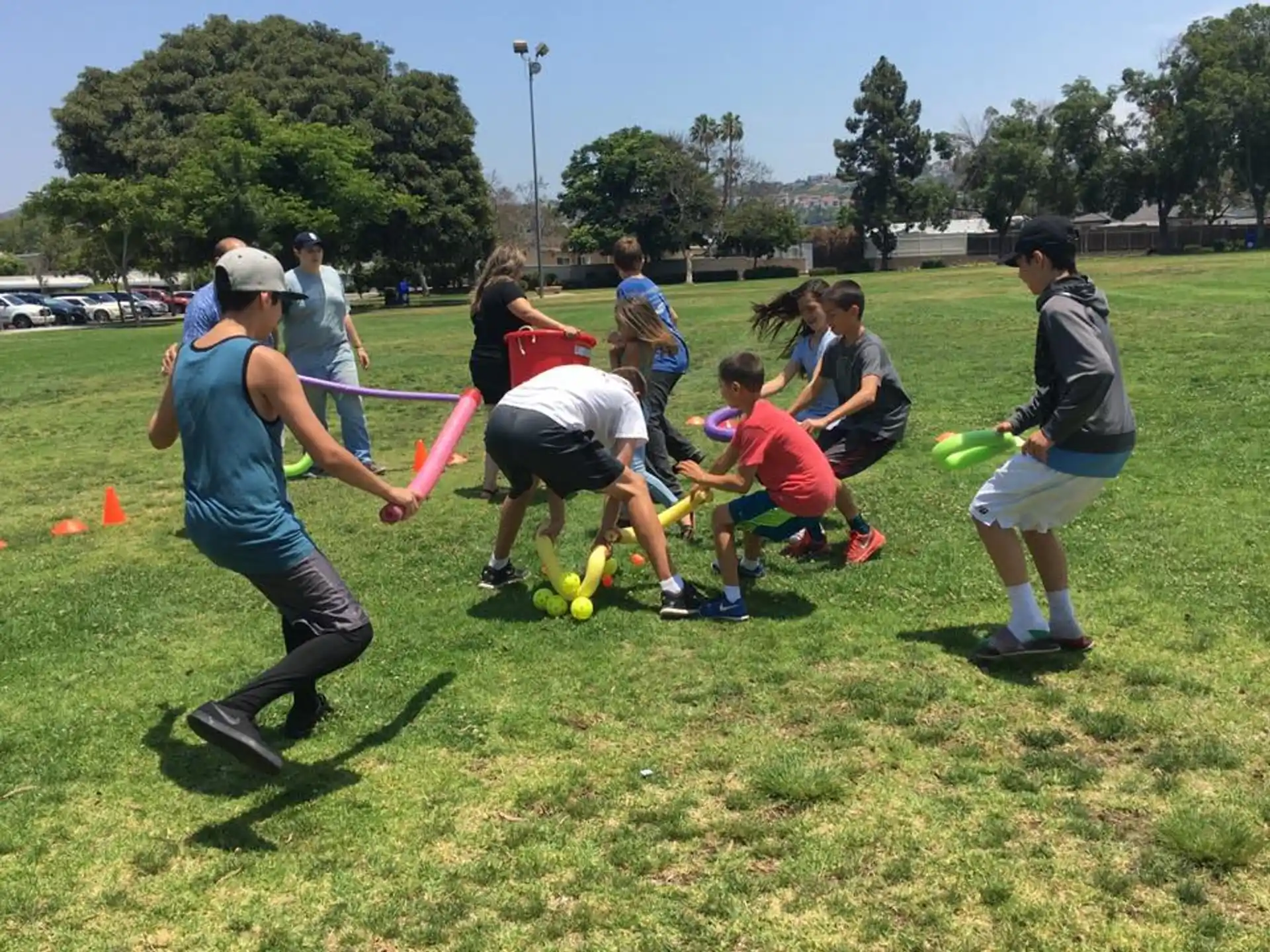 a group of people playing with a toy