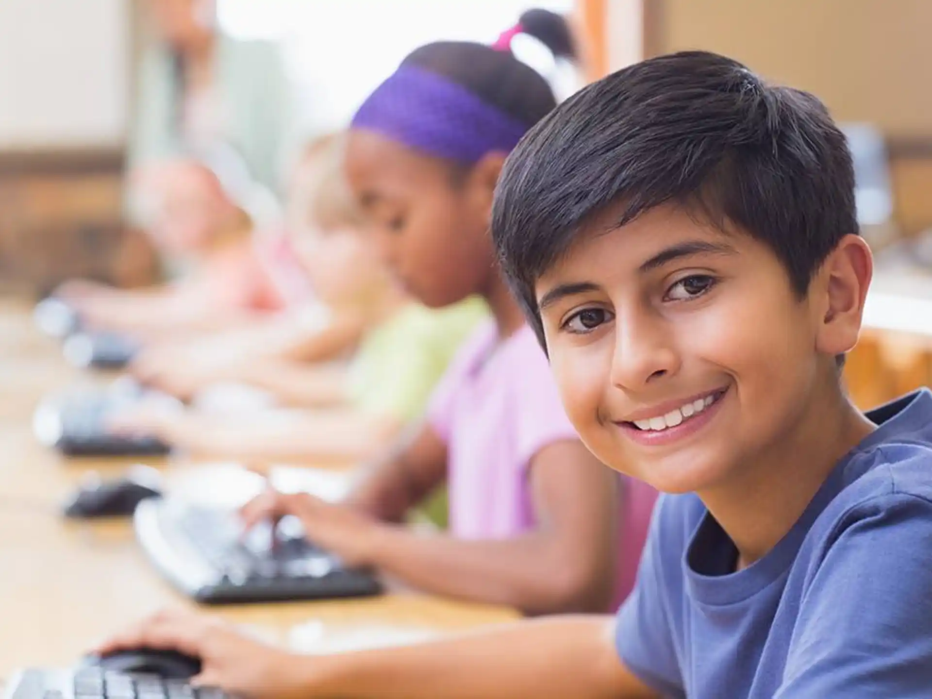 a close-up of a young boy smiling
