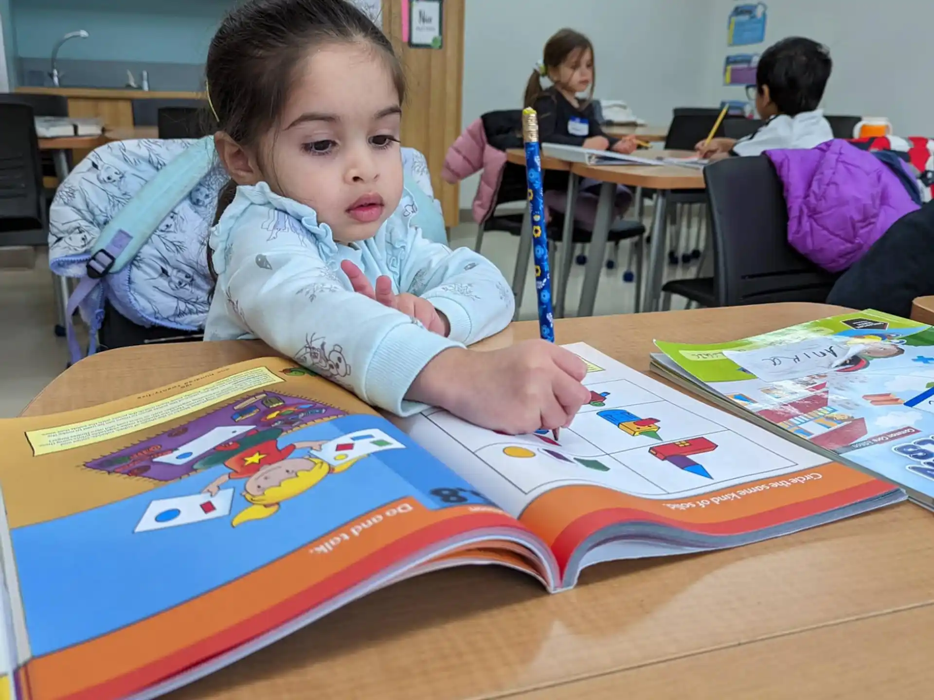 a child sitting at a table