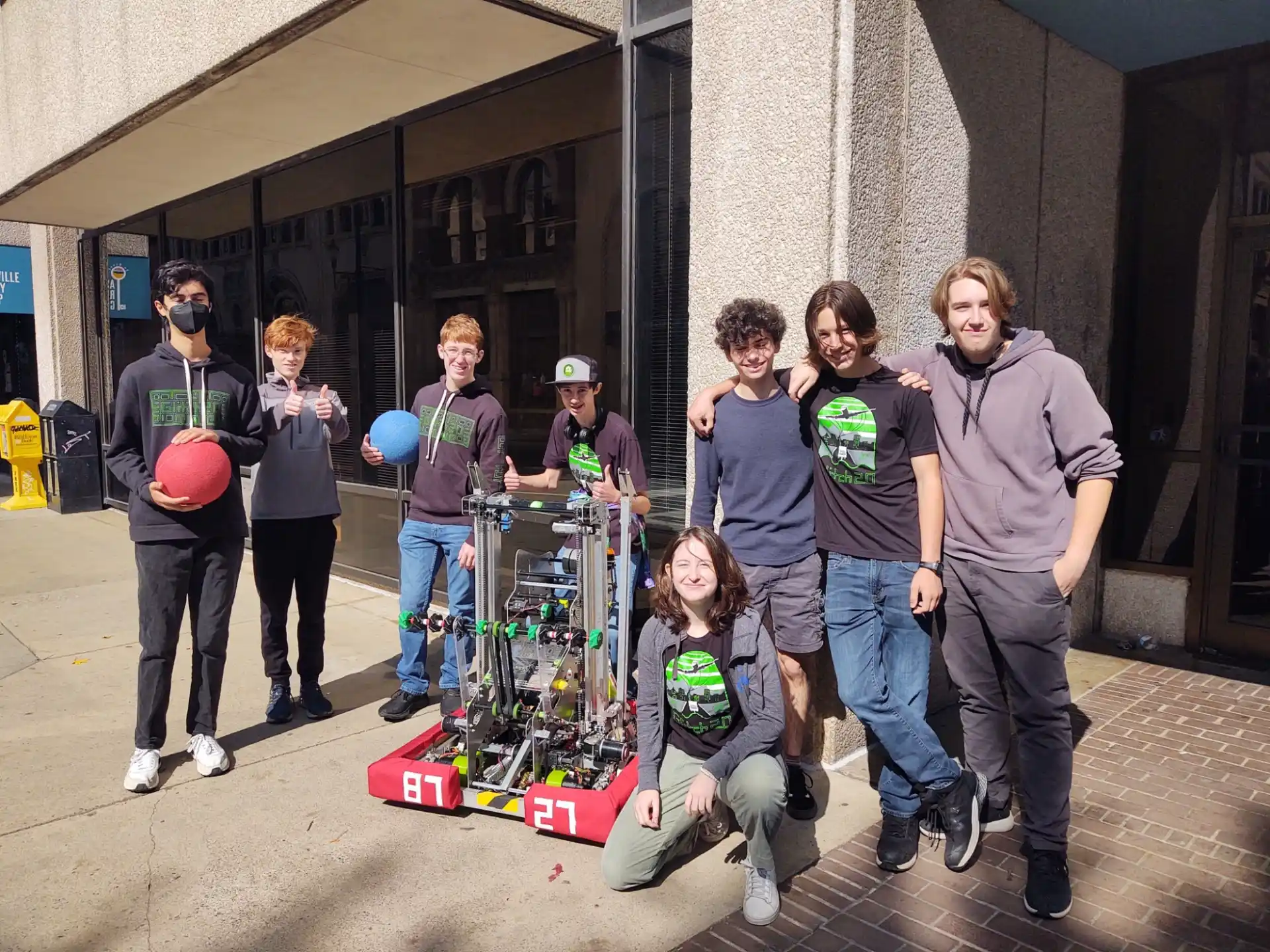 a group of people standing outside a building
