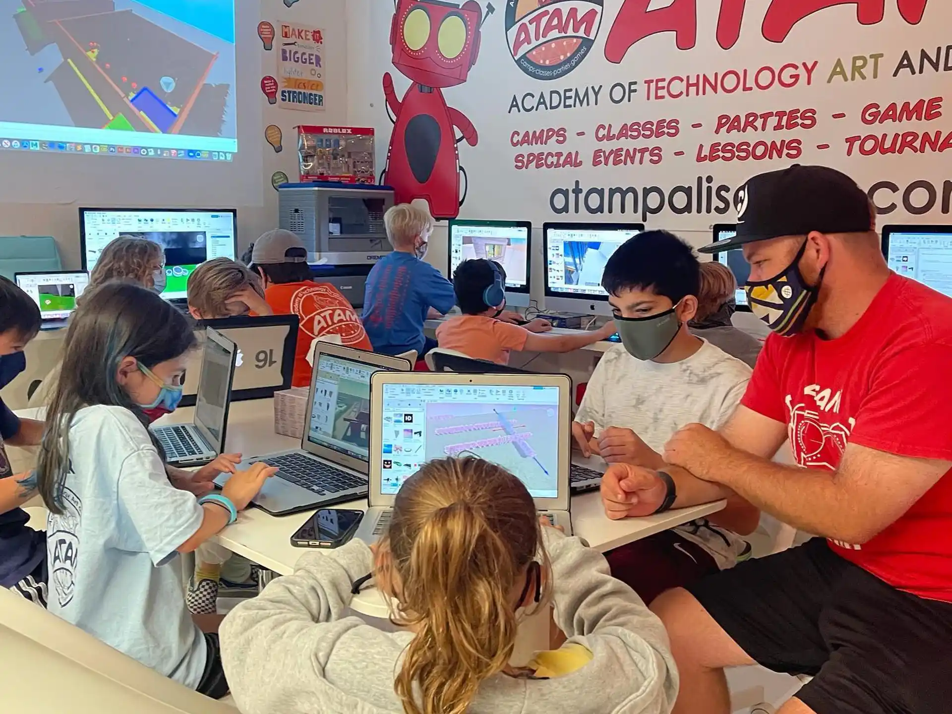a group of people sitting at computers