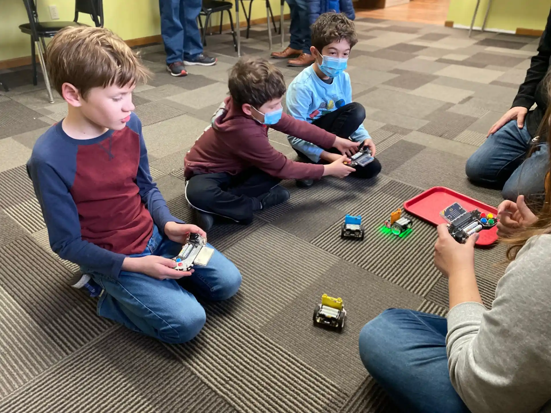 a group of kids playing with toys