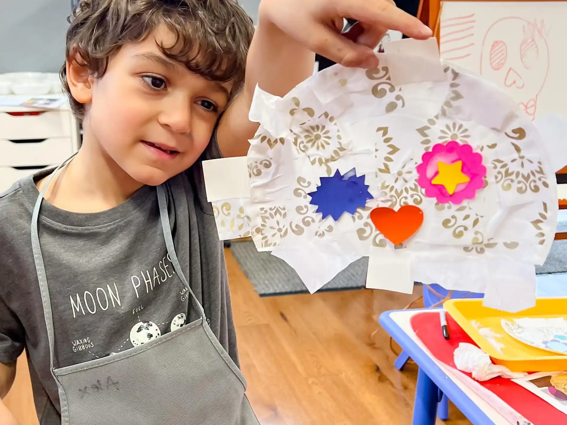 a child holding a kite