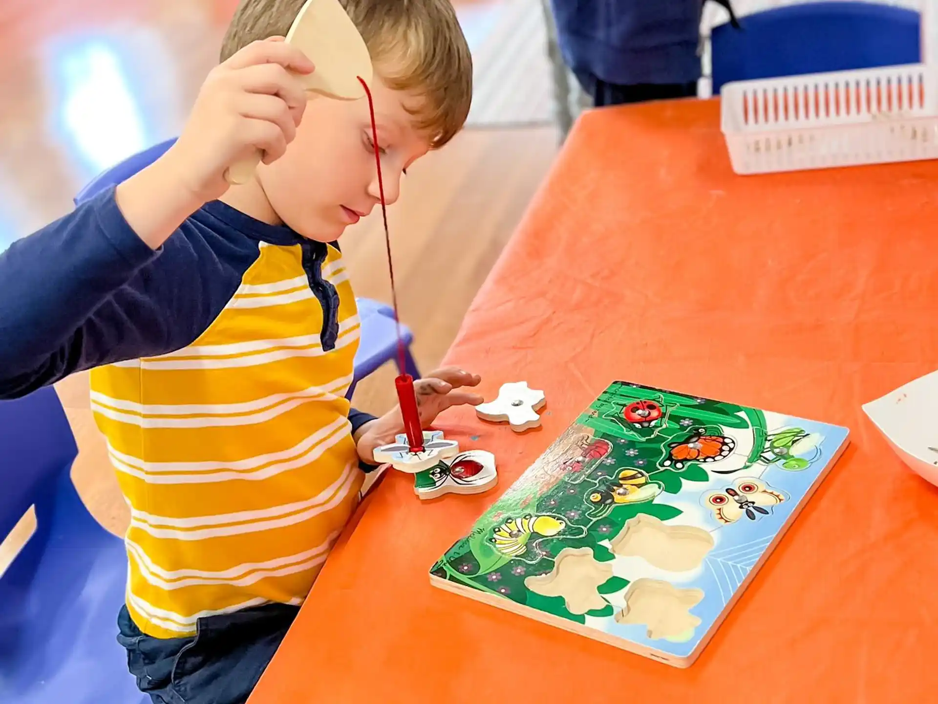 a child painting on a table