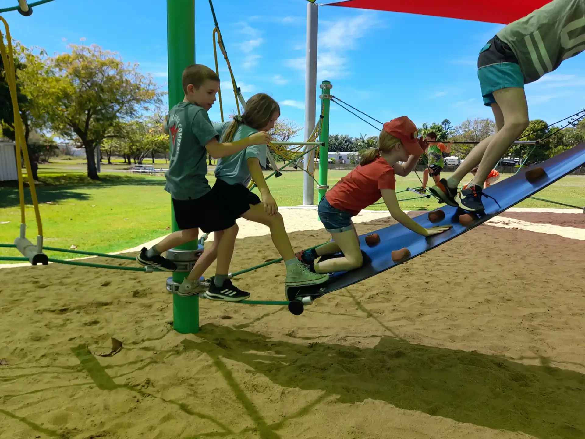 a group of kids playing on a playground
