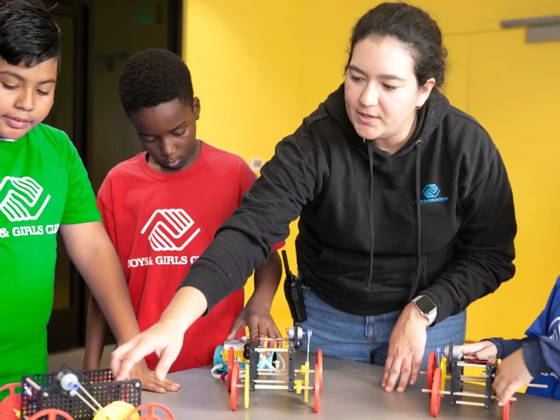a group of people playing with toys