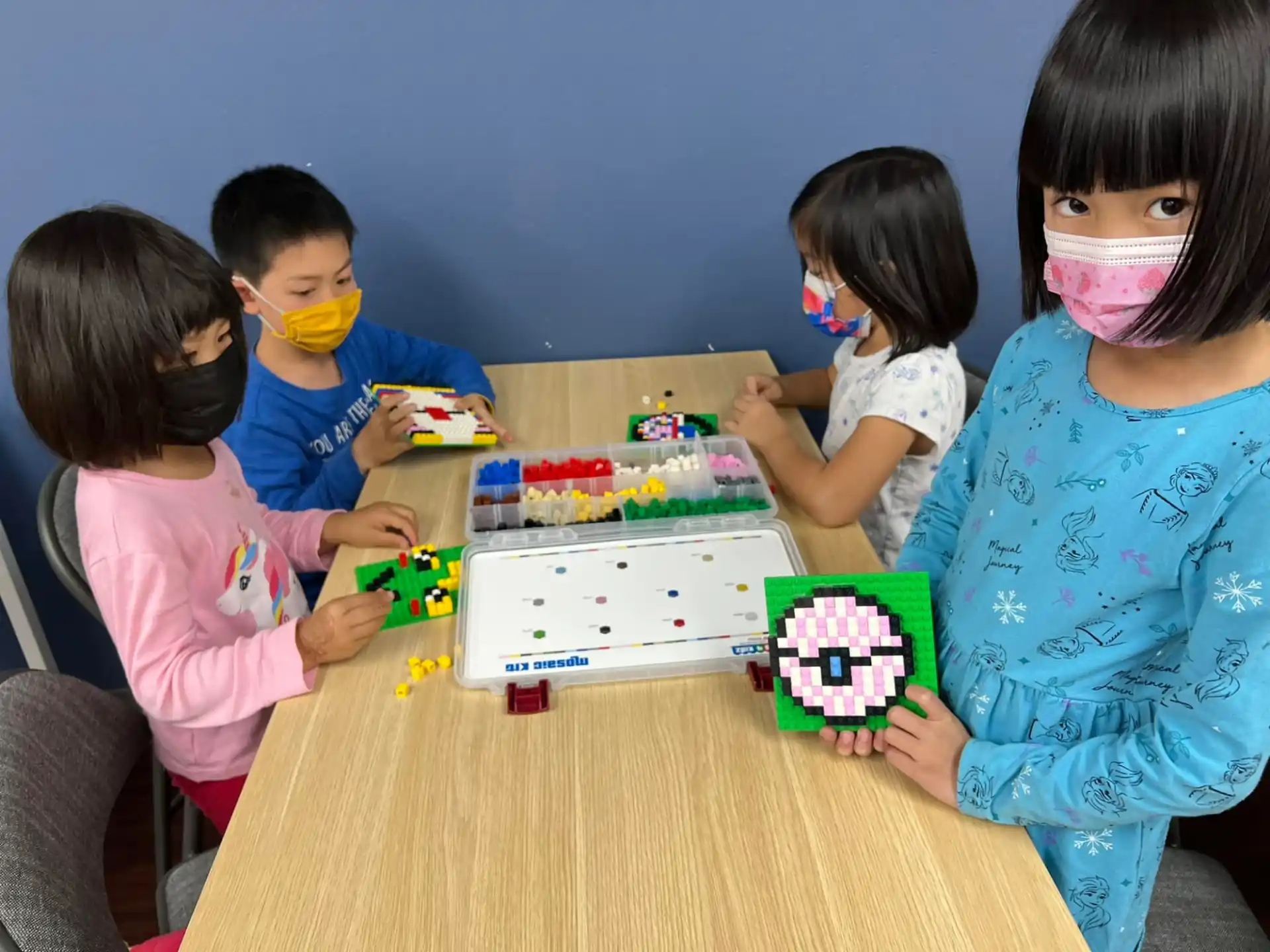 a group of children playing with toys