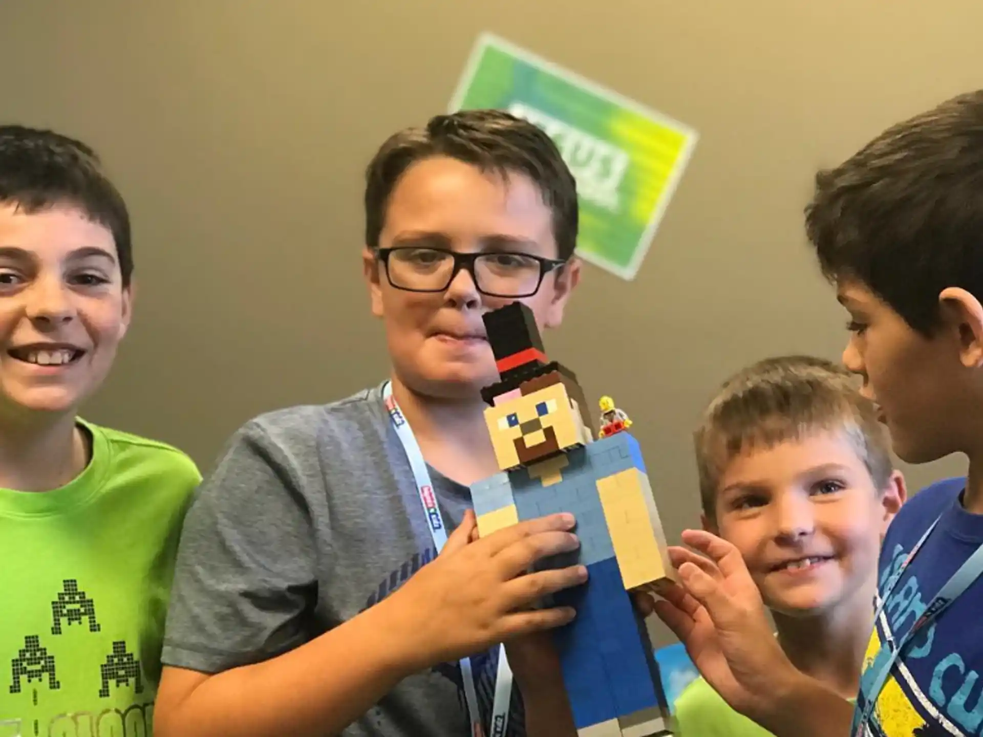 a group of boys holding a toy