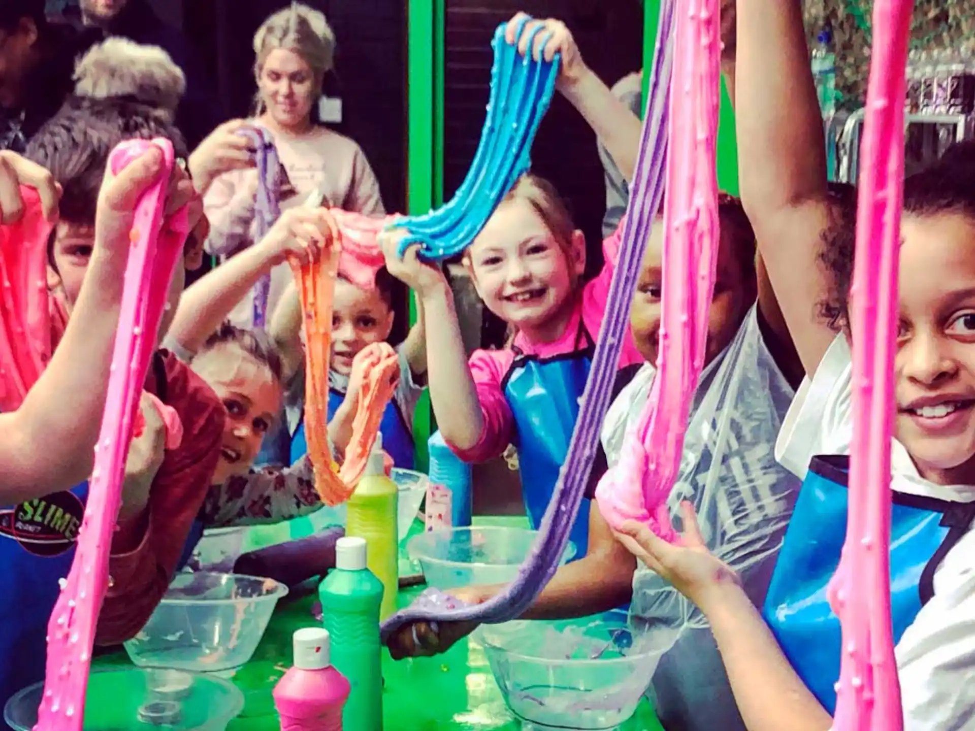a group of people holding colored sticks