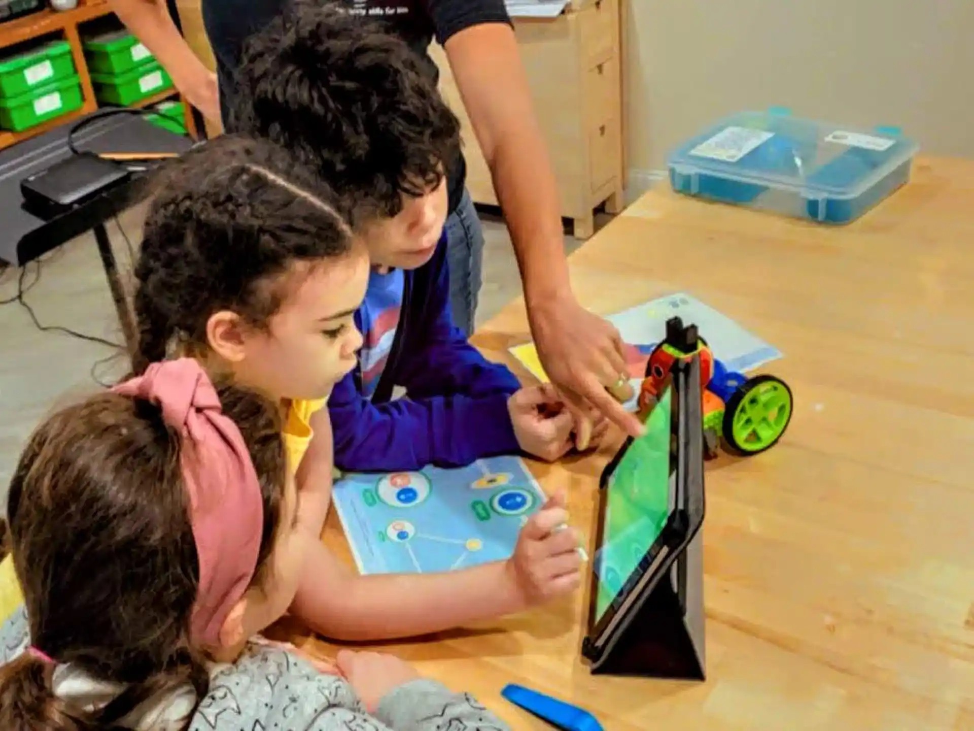 a group of children playing with a toy