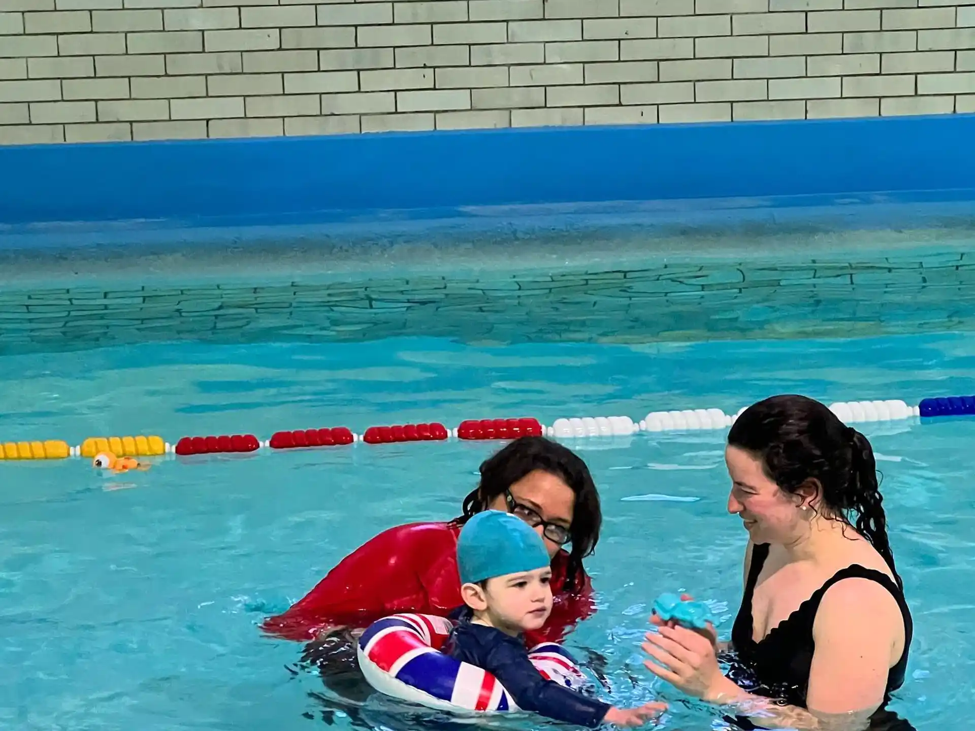 a person and a child in a pool