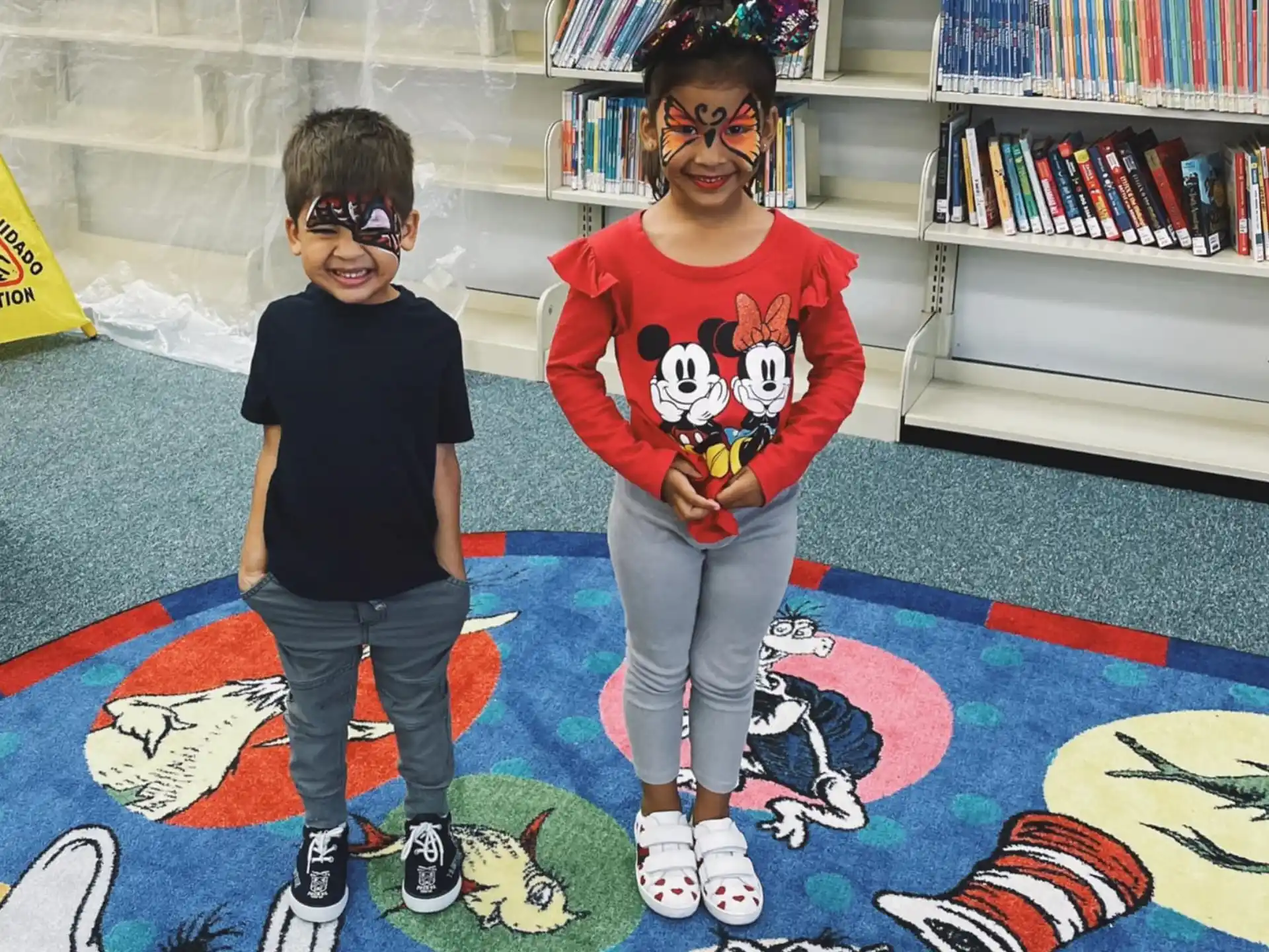 a couple of kids wearing clothing