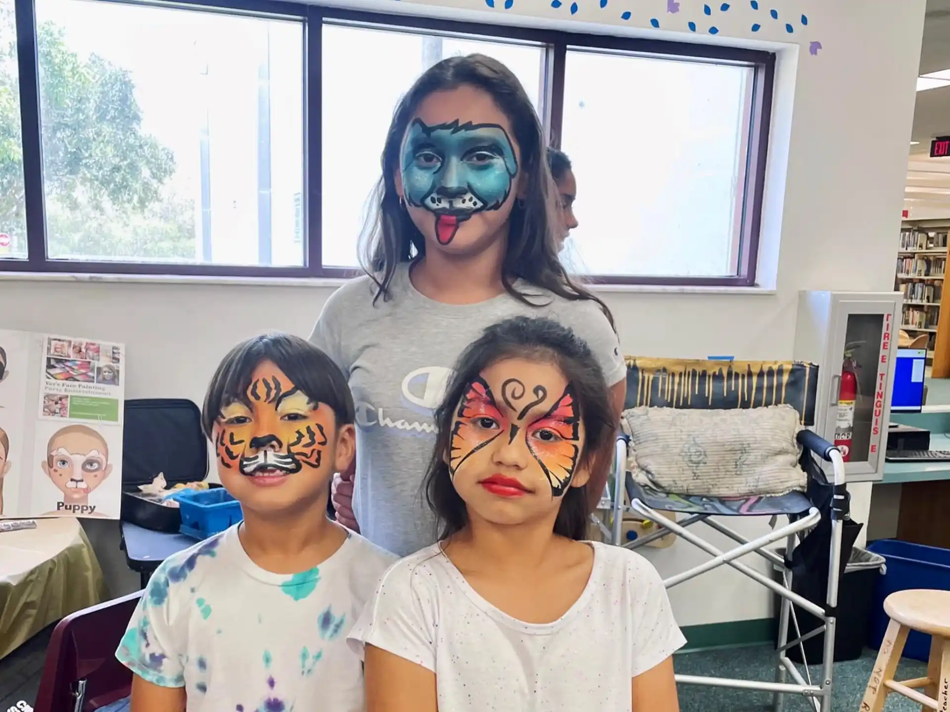 a person and two children with face paint