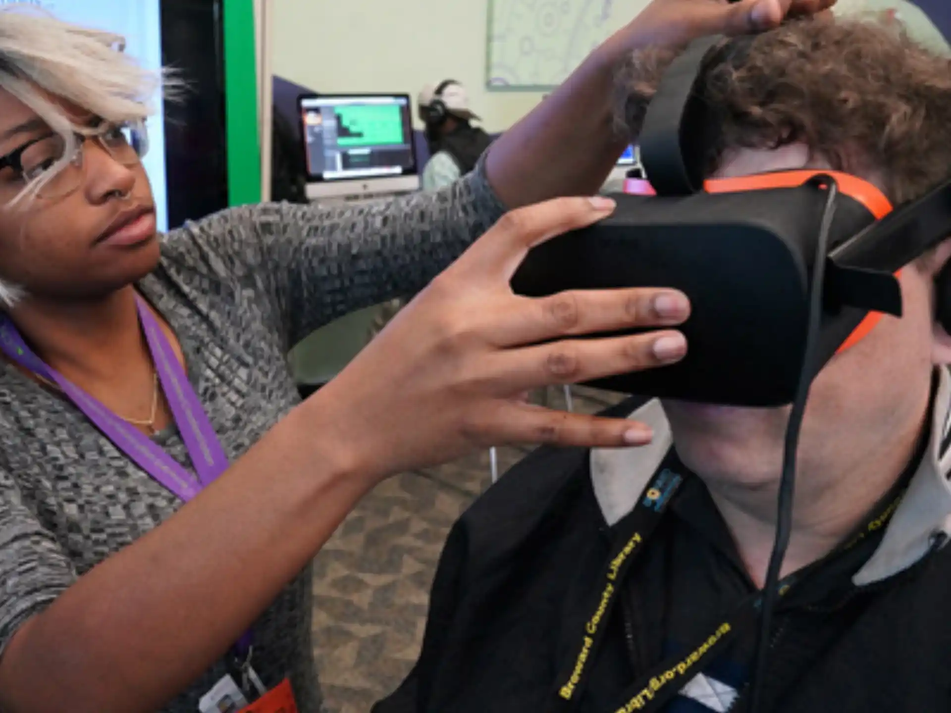 a person holding a phone to a person's ear