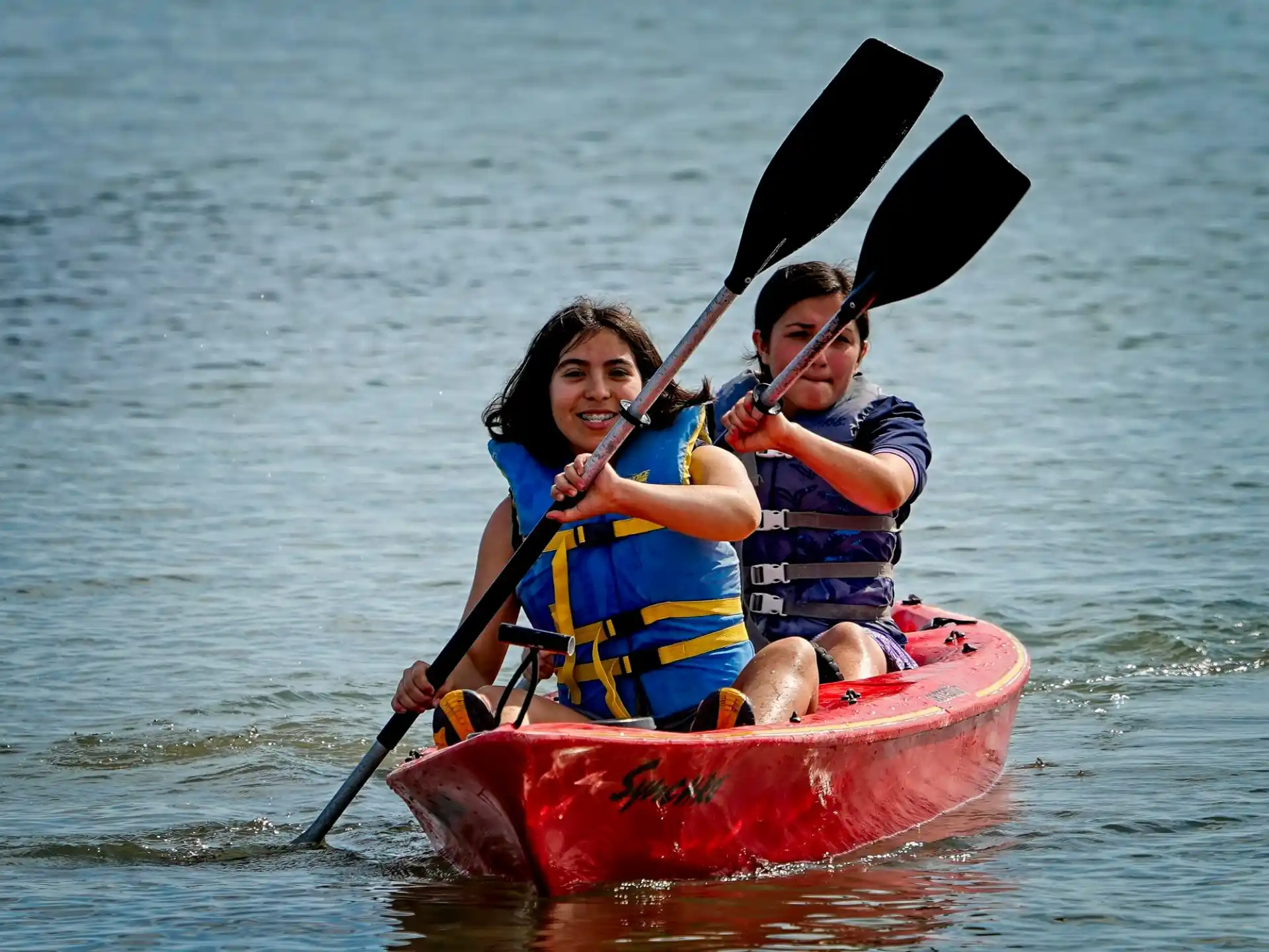 a couple of people in a canoe