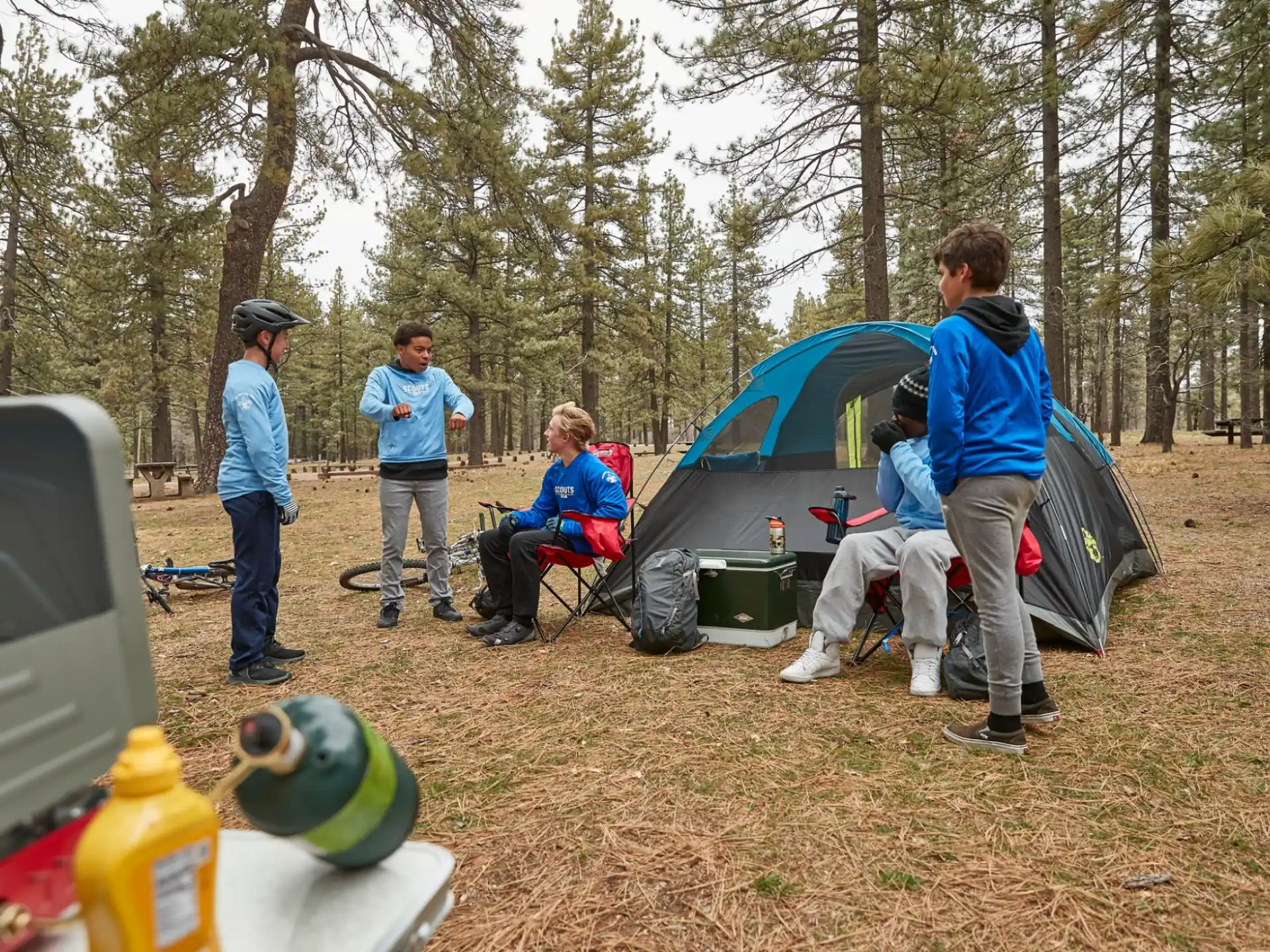a group of people outside by a tent