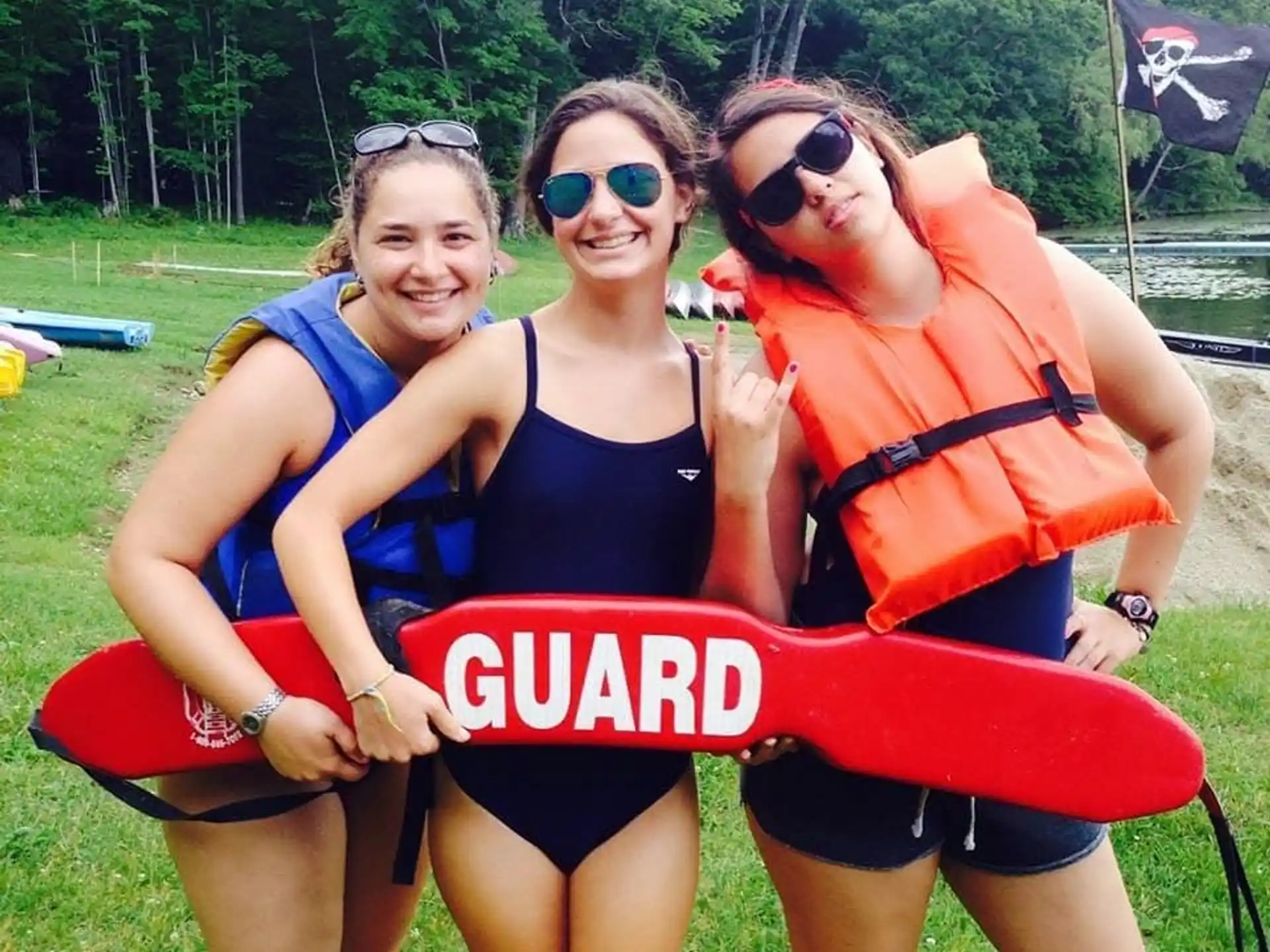 a group of women in swimsuits posing for a photo