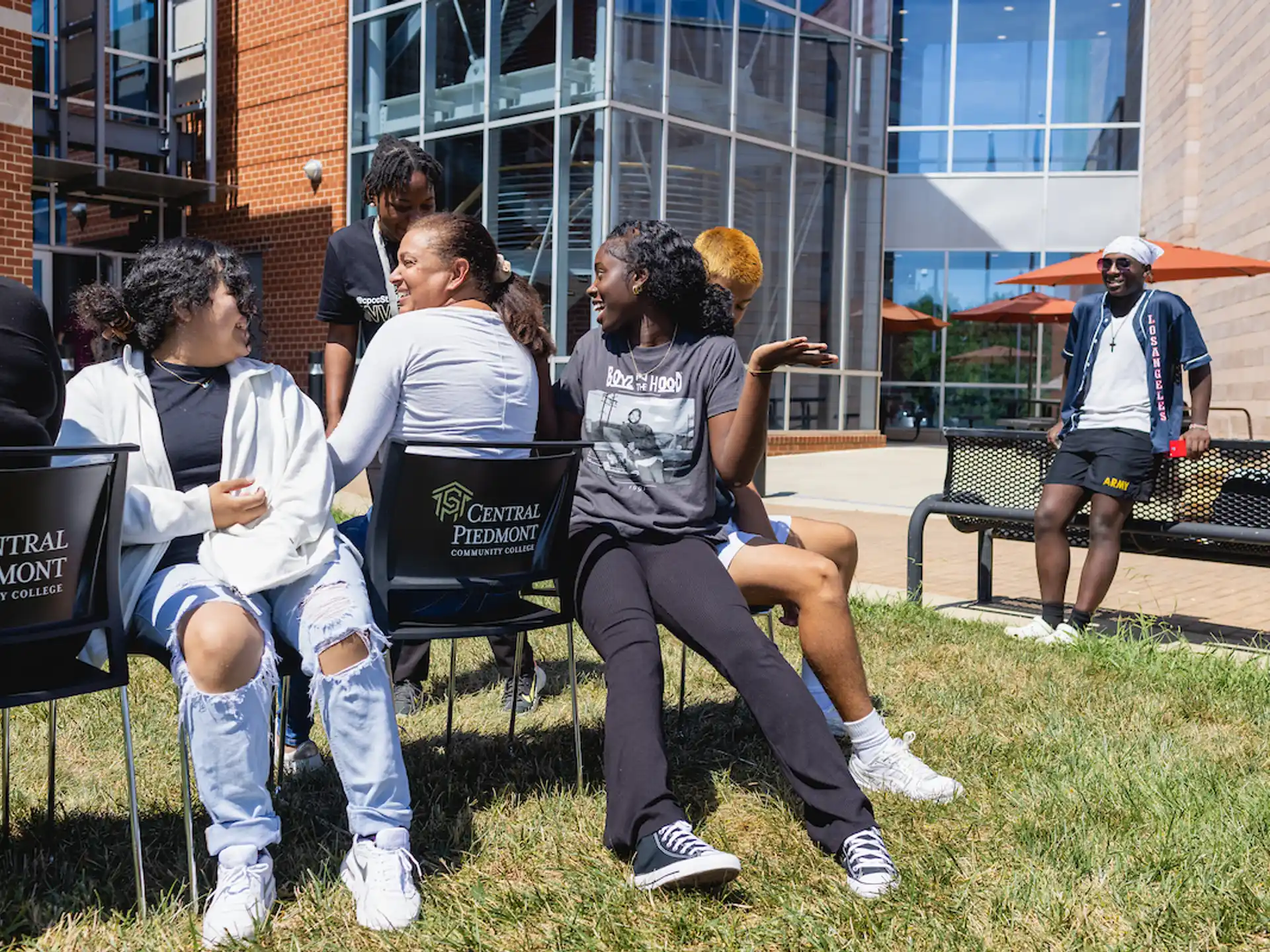 a group of people sitting in chairs outside