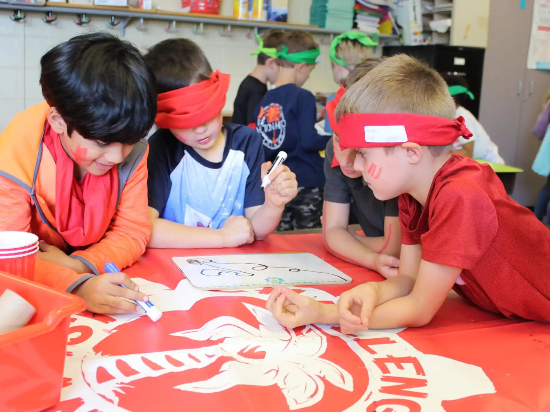 a group of children painting