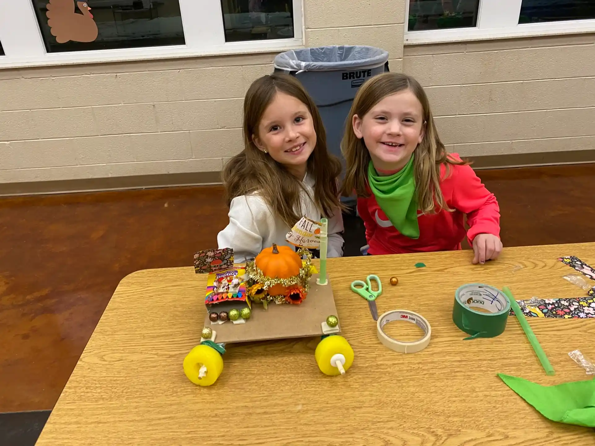 two girls sitting at a table