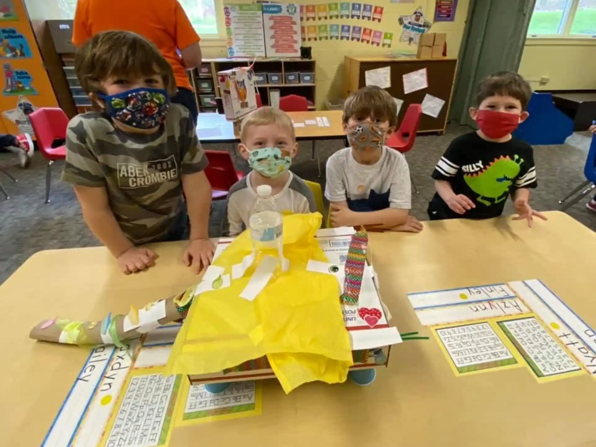 a group of children wearing masks