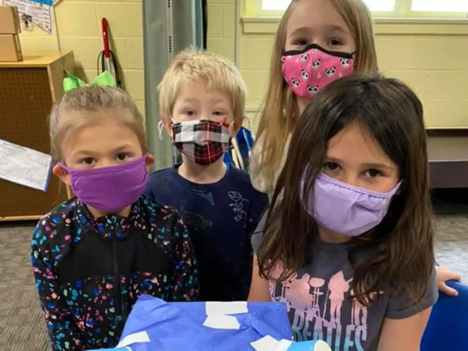 a group of children with paint on their faces