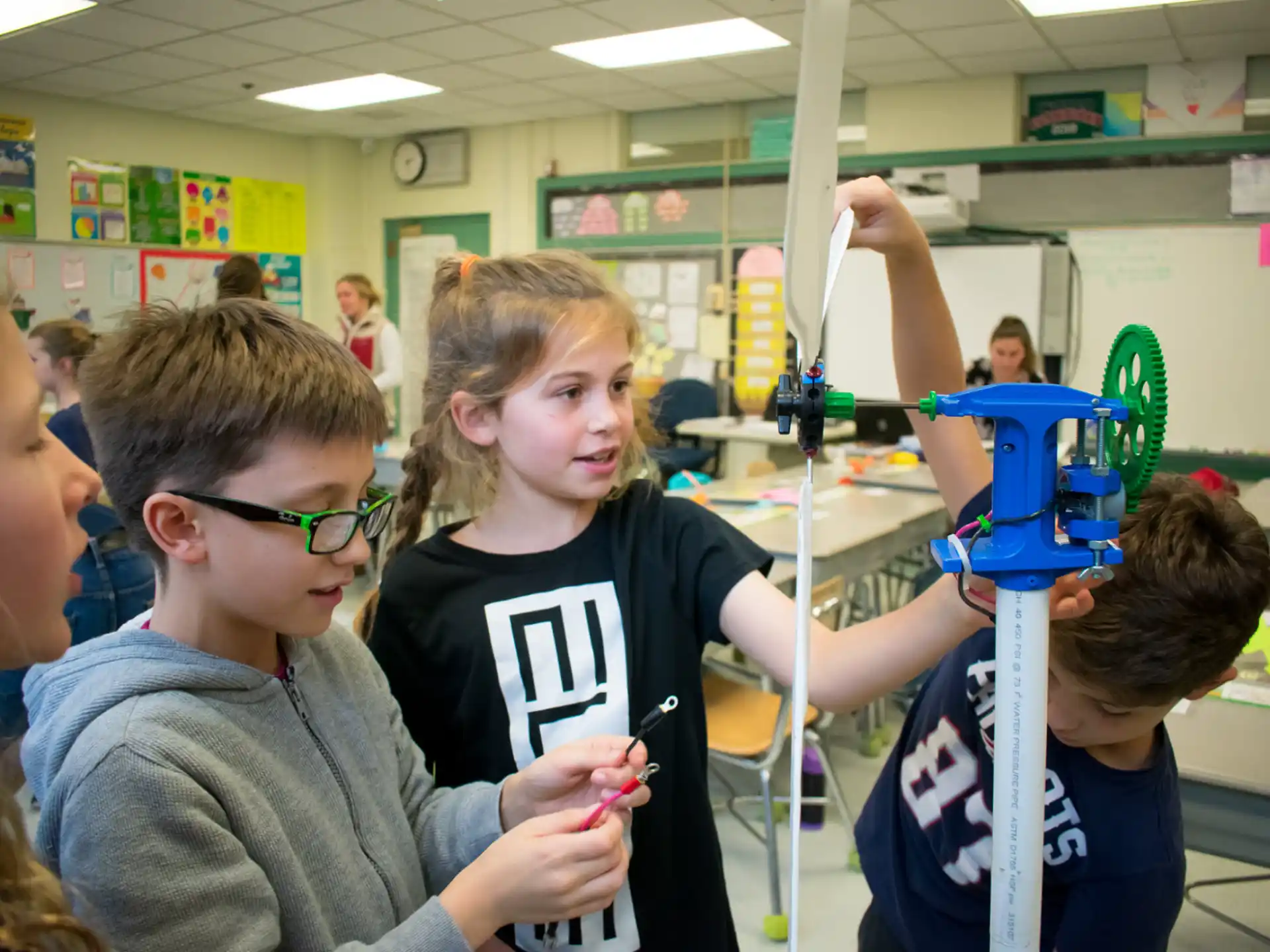 a group of kids playing with a toy
