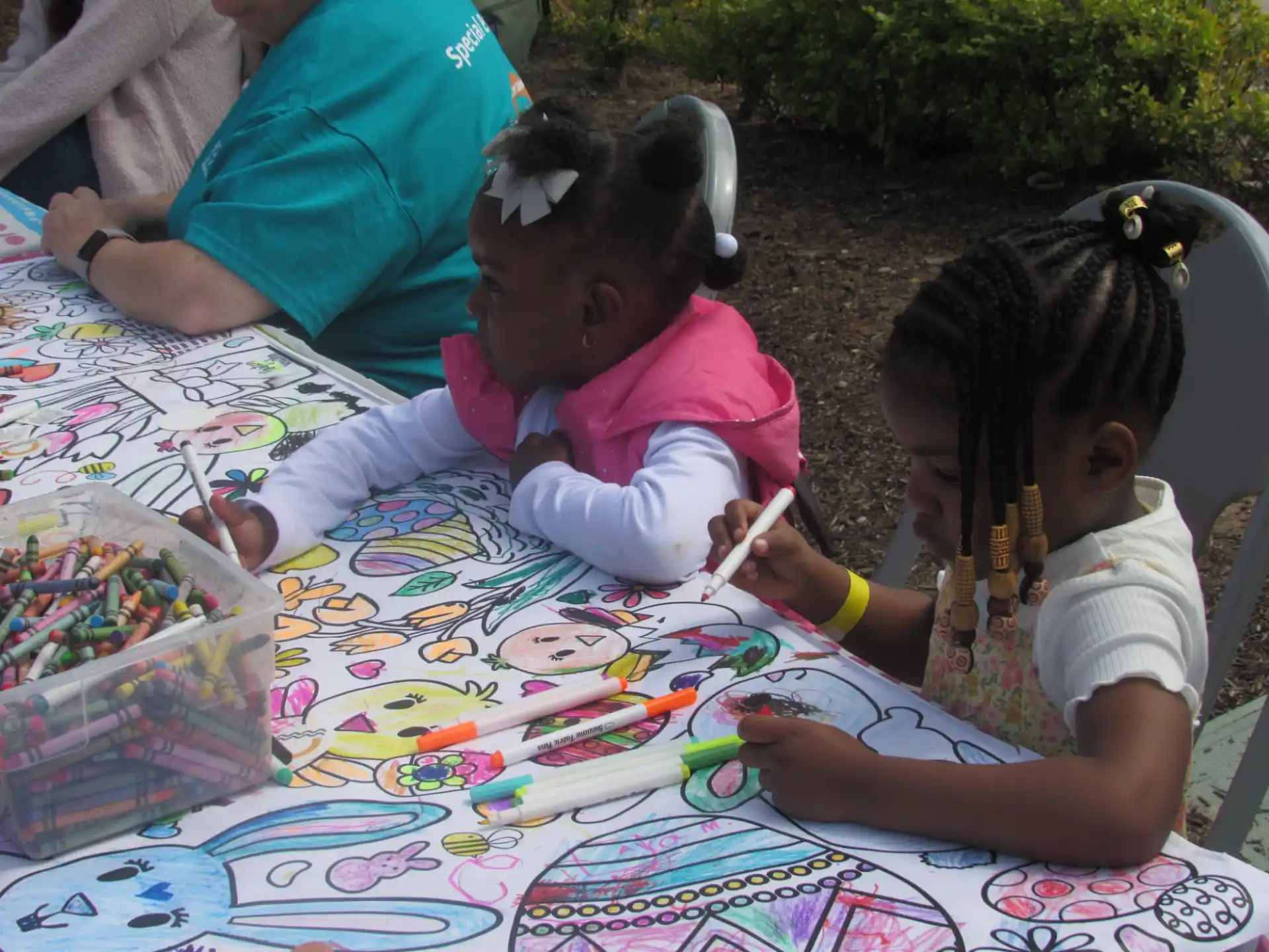 a person and a child painting