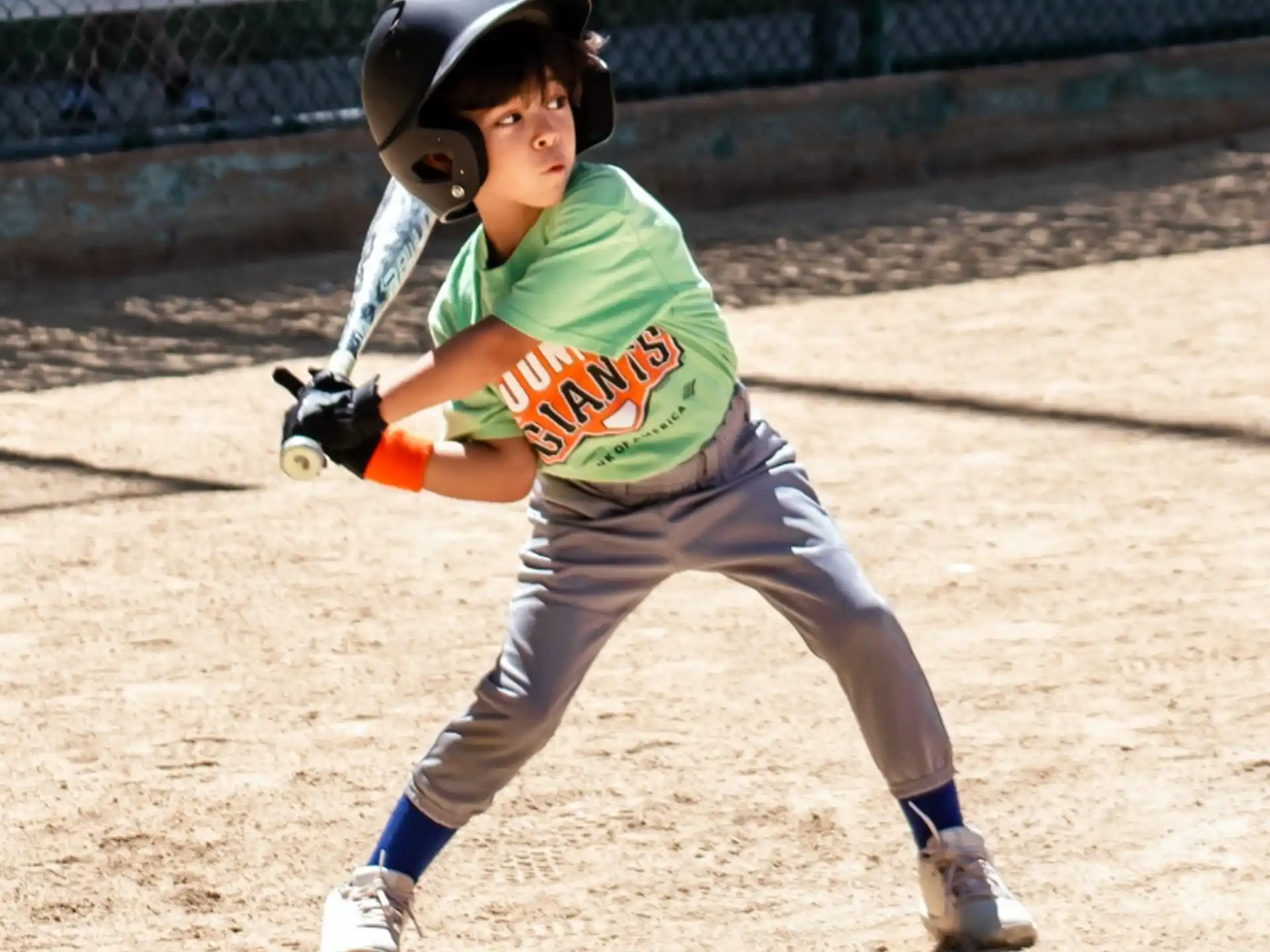 a young boy playing baseball