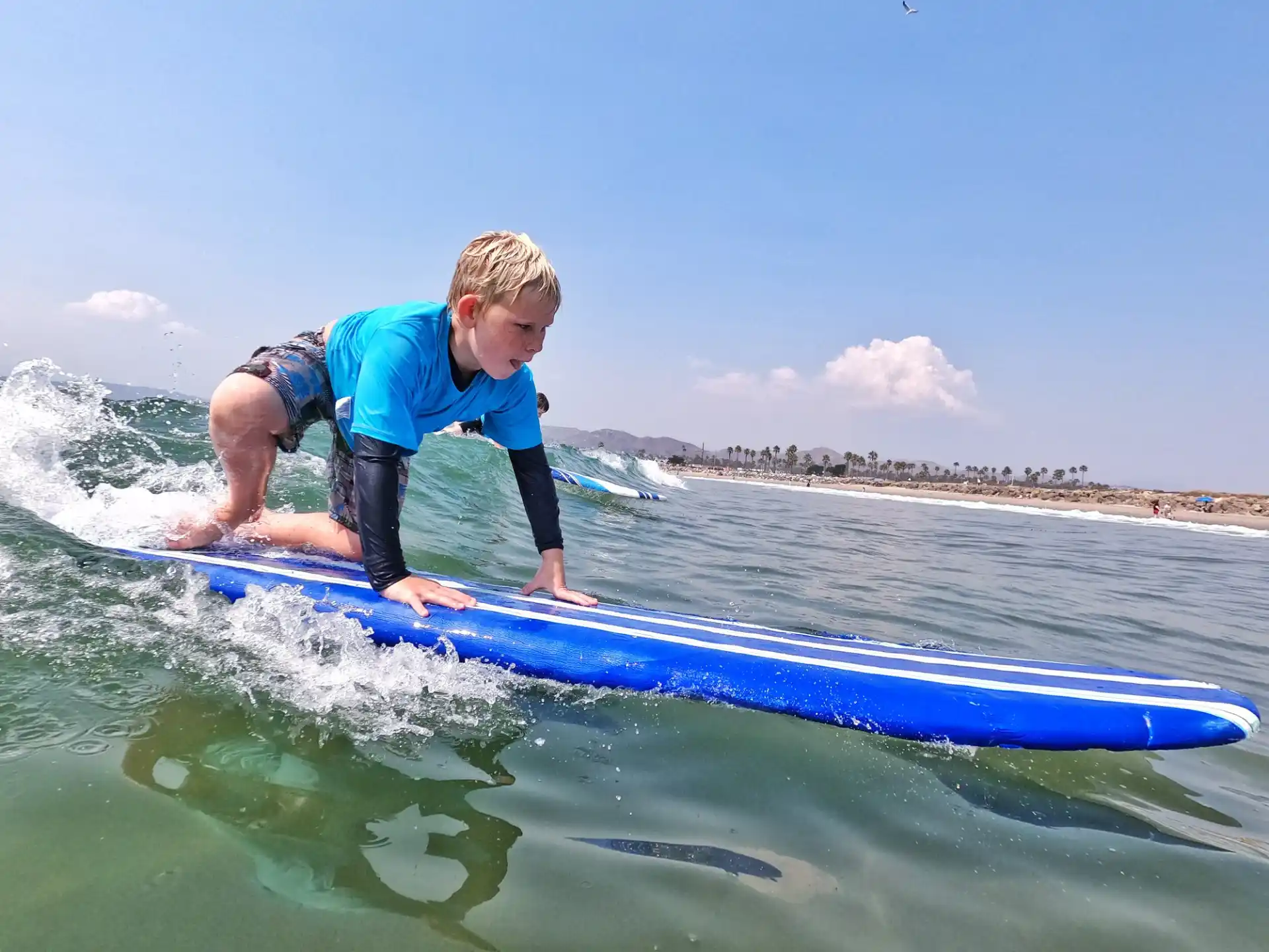 a kid riding a surfboard