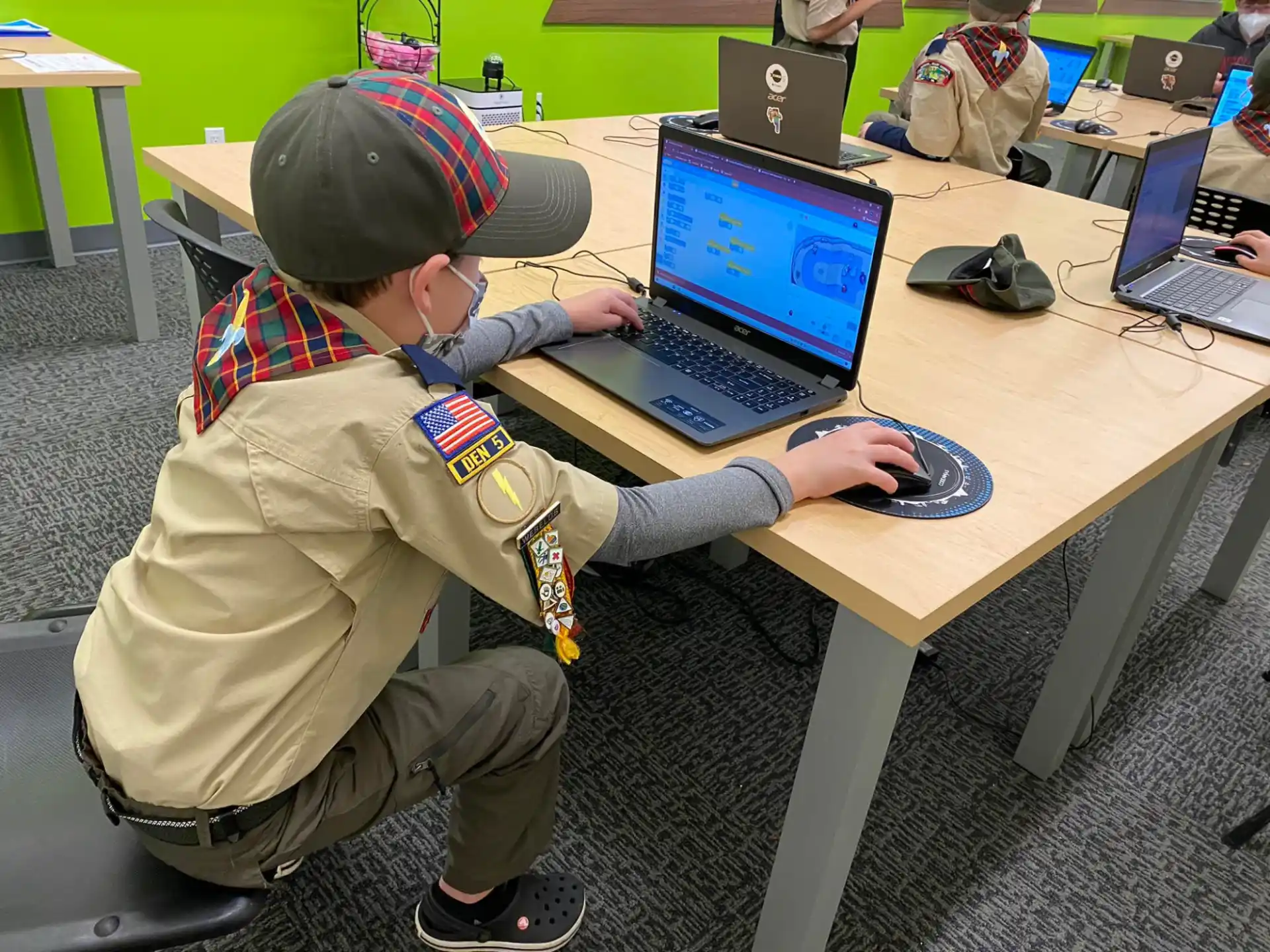a boy using a computer