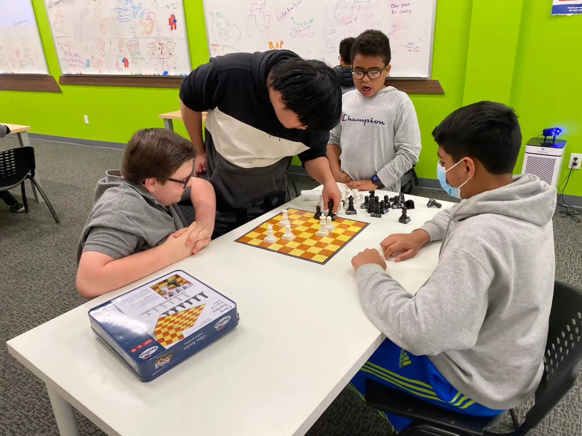 a group of people playing chess