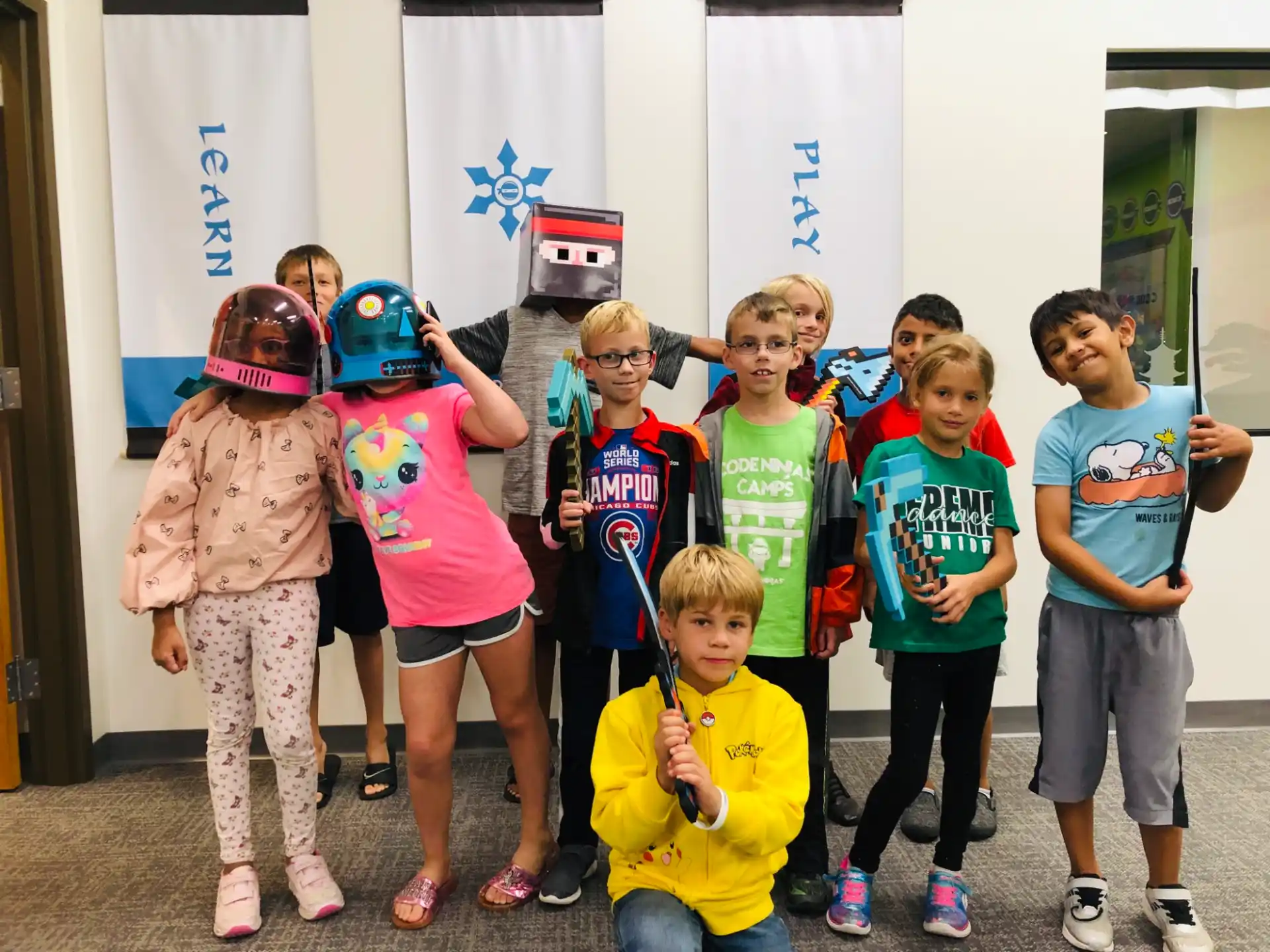 a group of kids wearing helmets