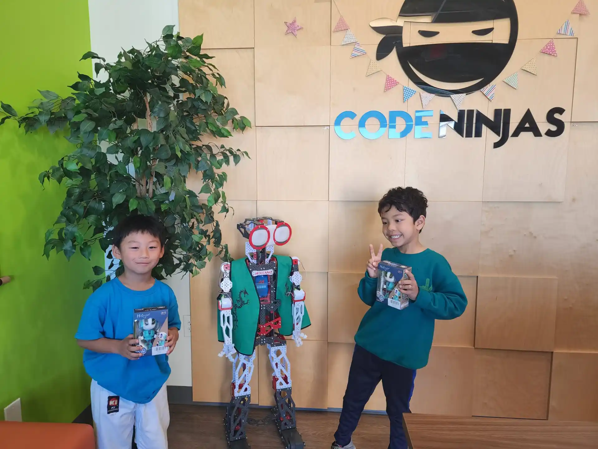 a couple of boys holding toys