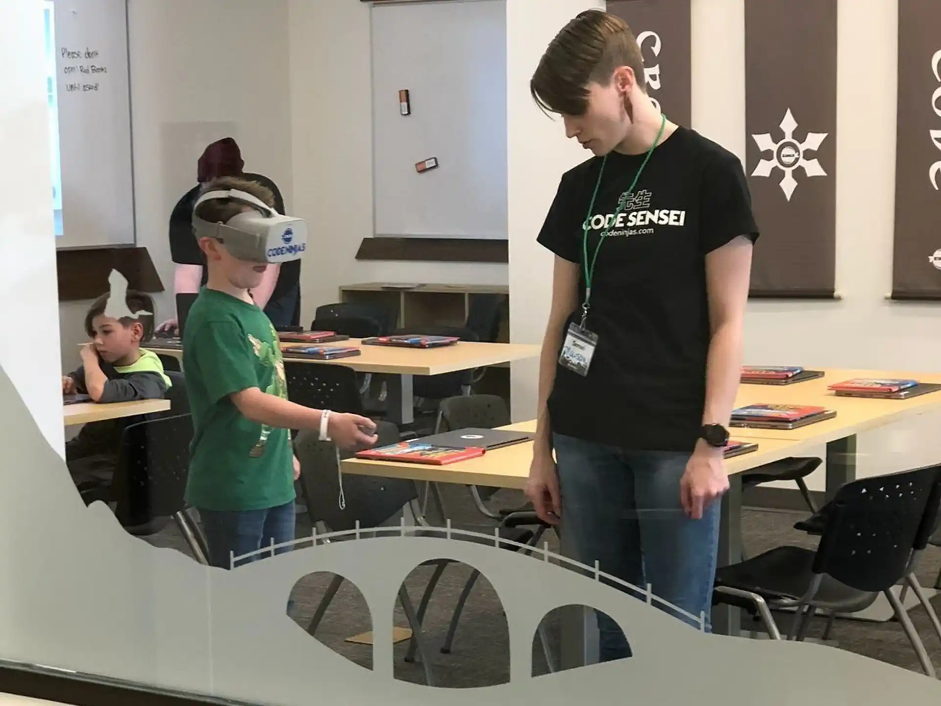 a man and a boy in a classroom