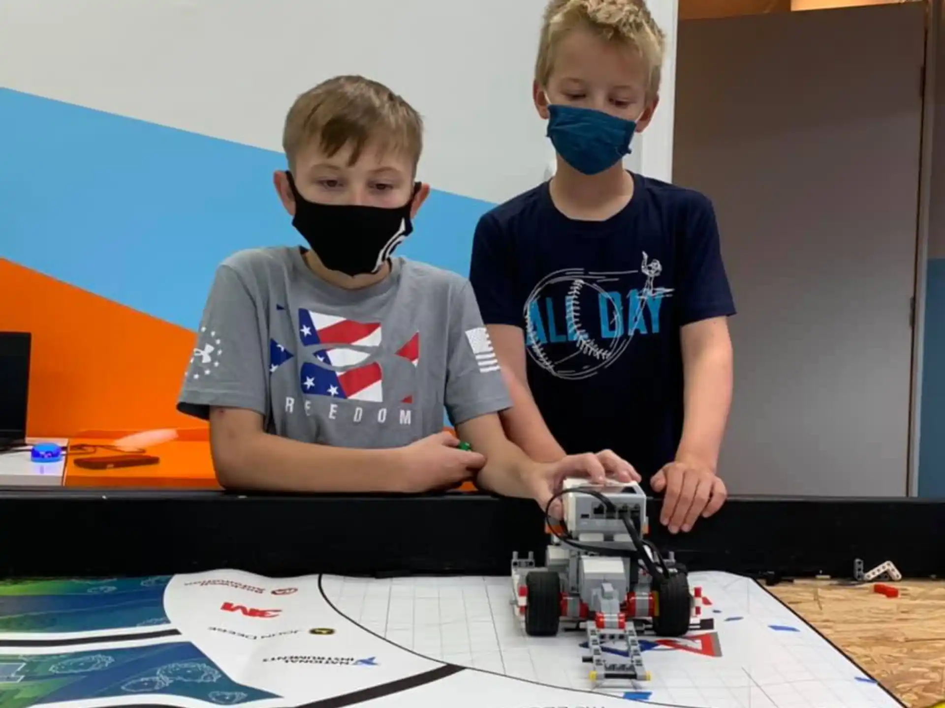 a few boys wearing masks