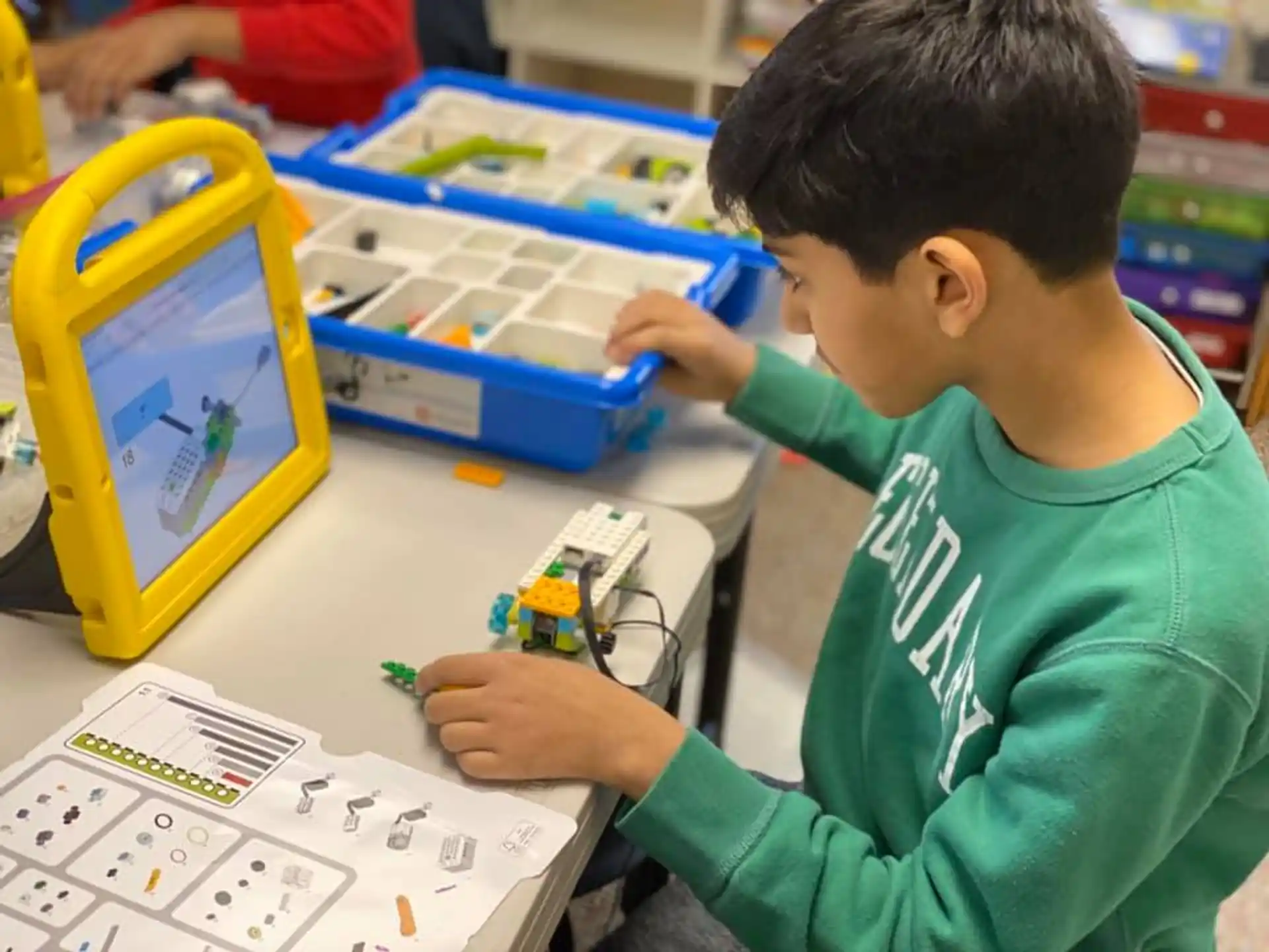 a young boy playing with a toy