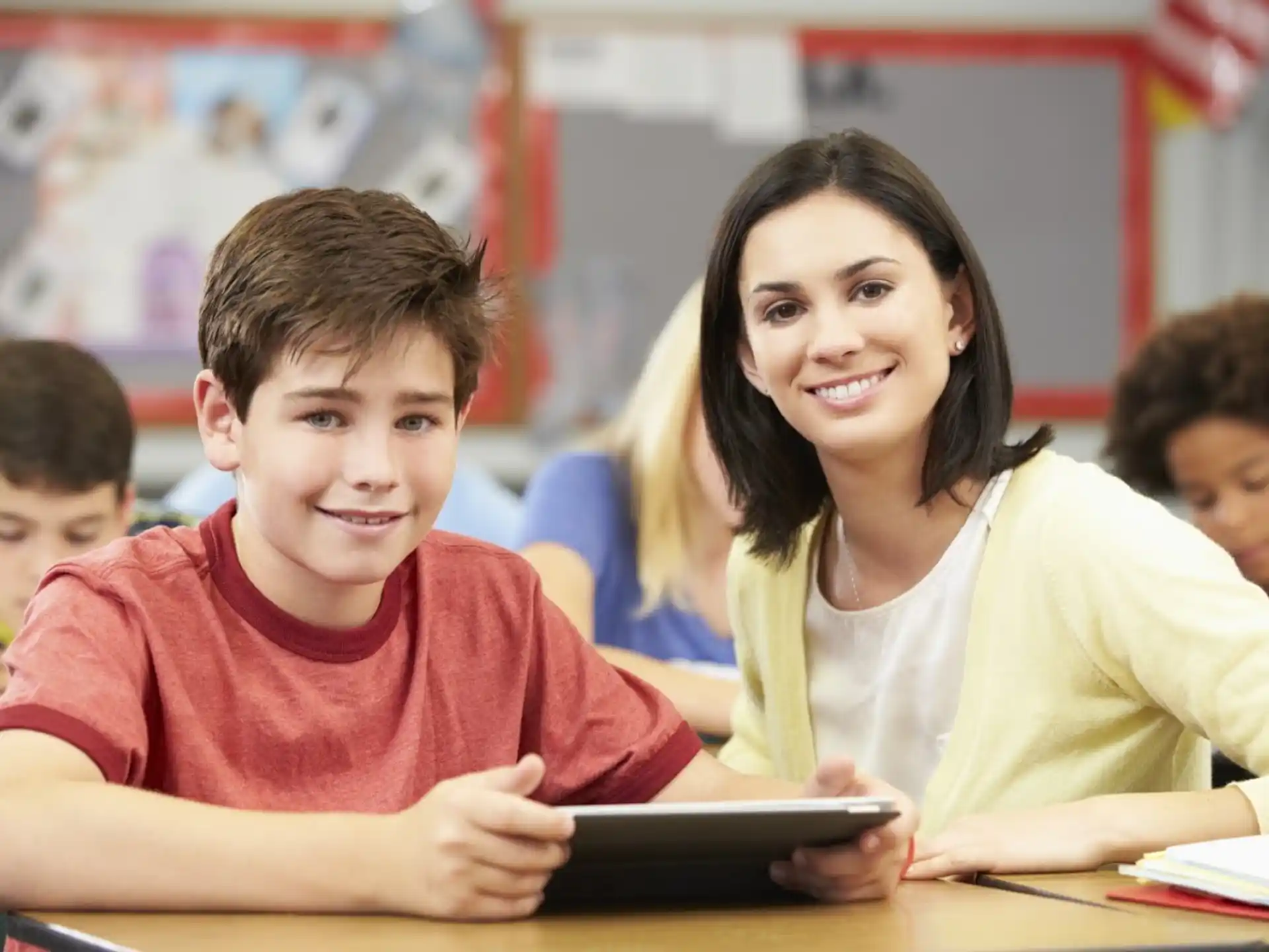 a person and a boy sitting at a table