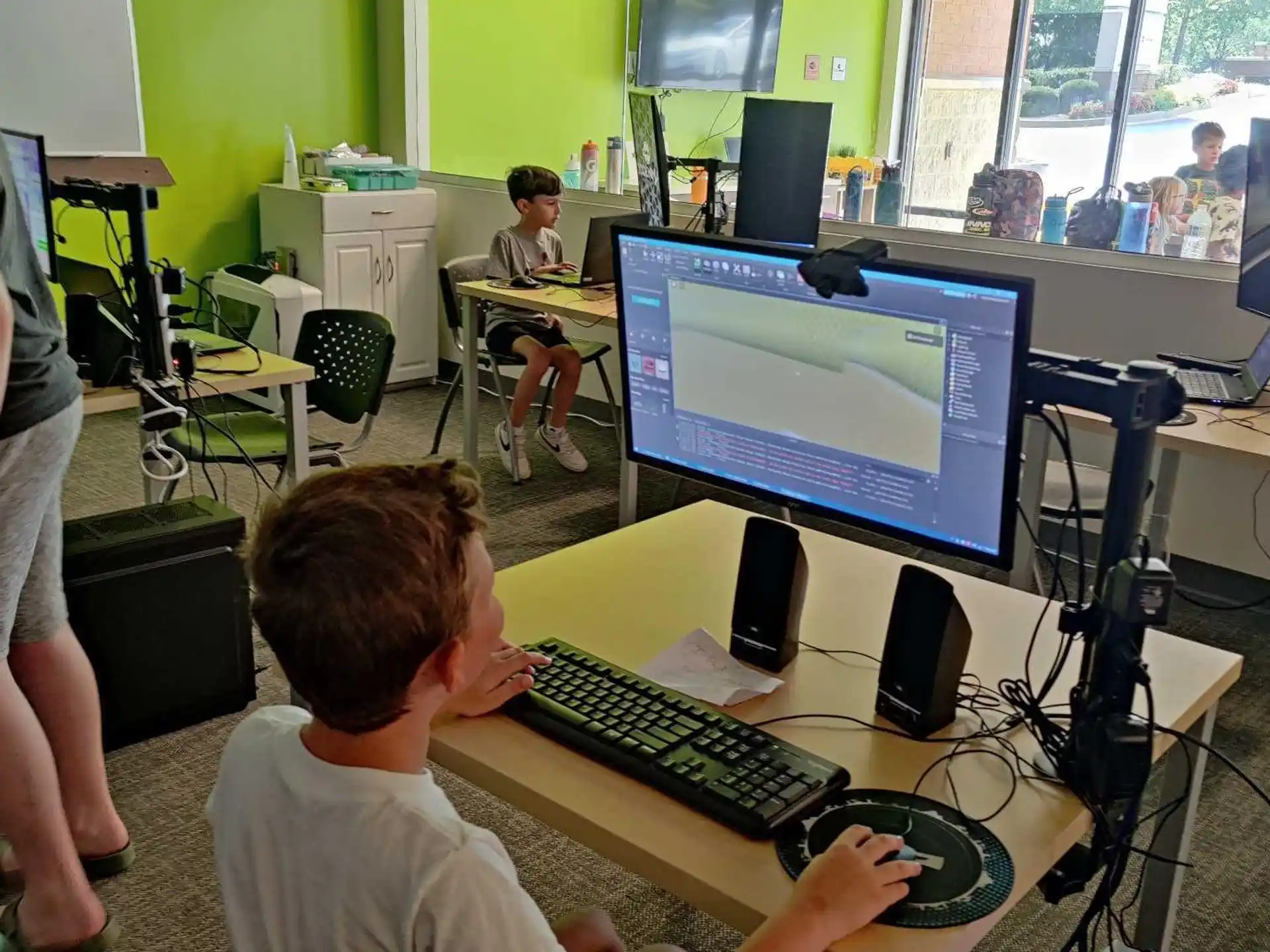a boy using a computer