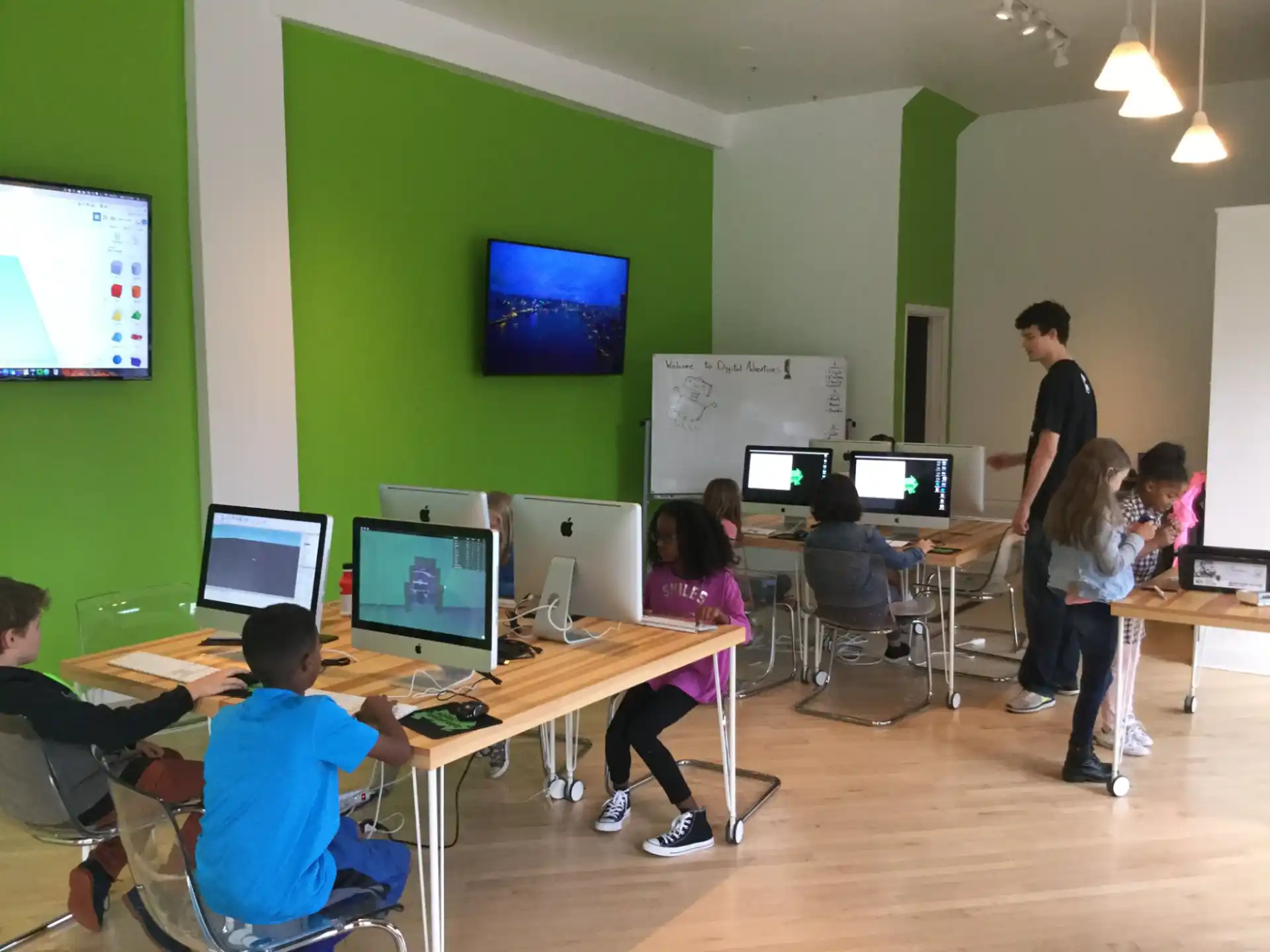 a group of people in a room with computers