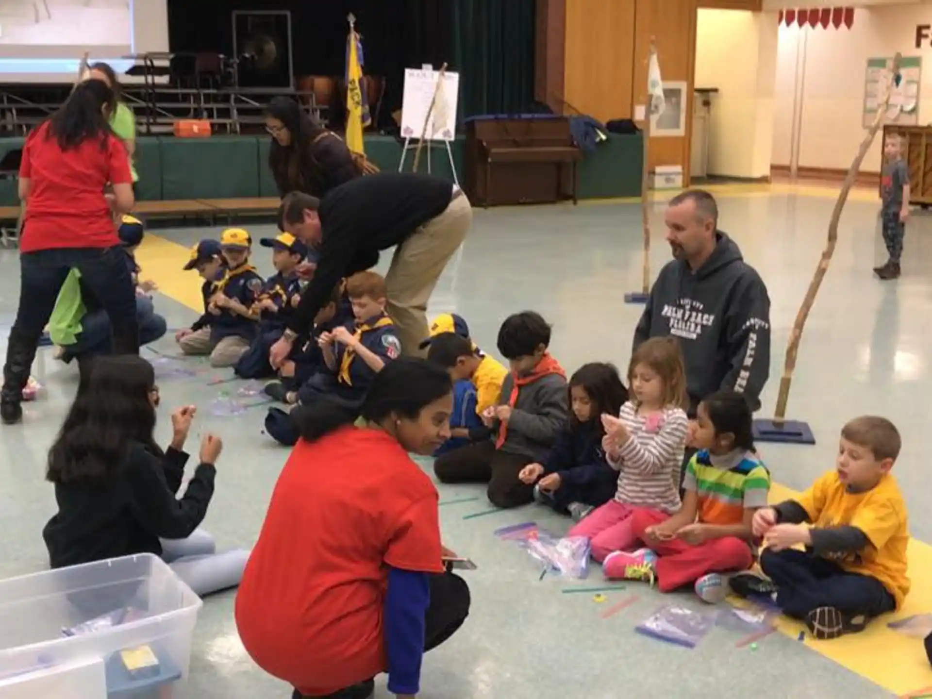 a group of people sitting on the floor