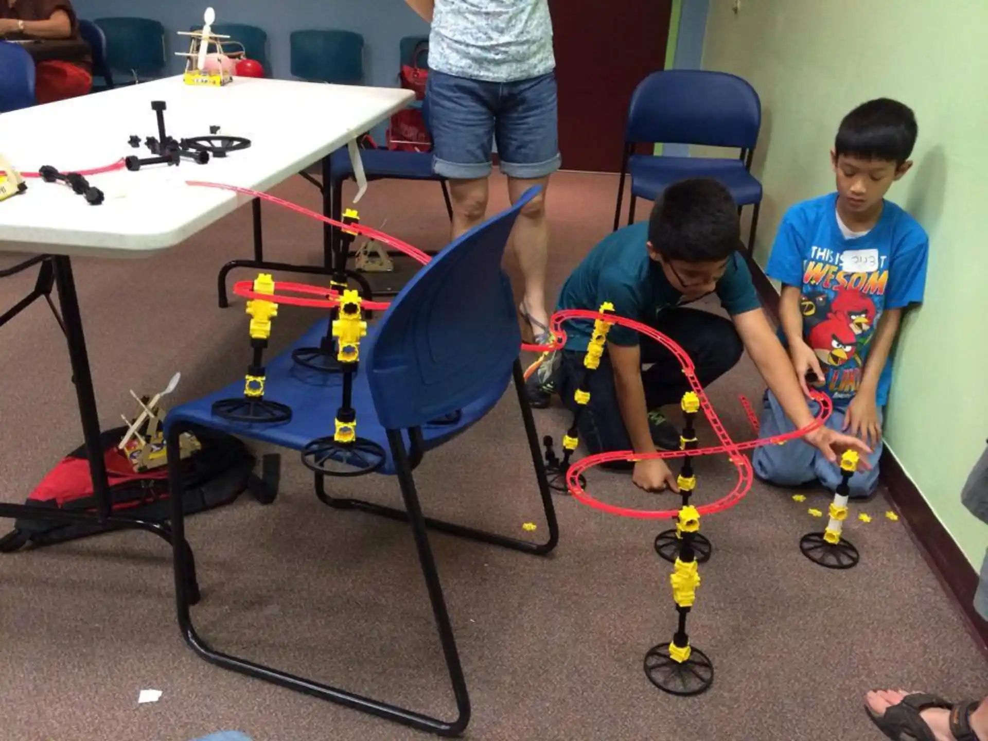 a couple of boys playing with toys