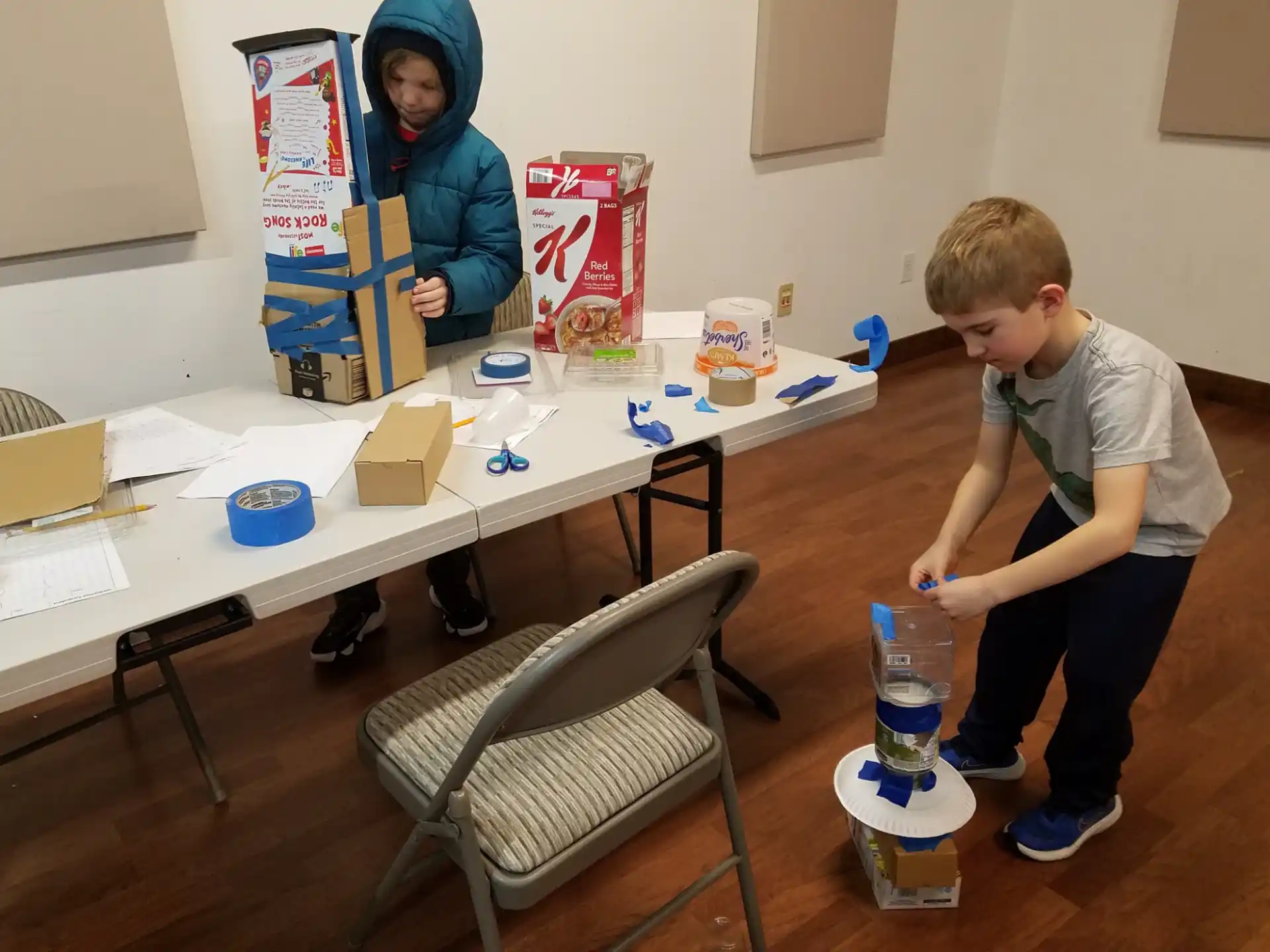 a boy and a girl painting