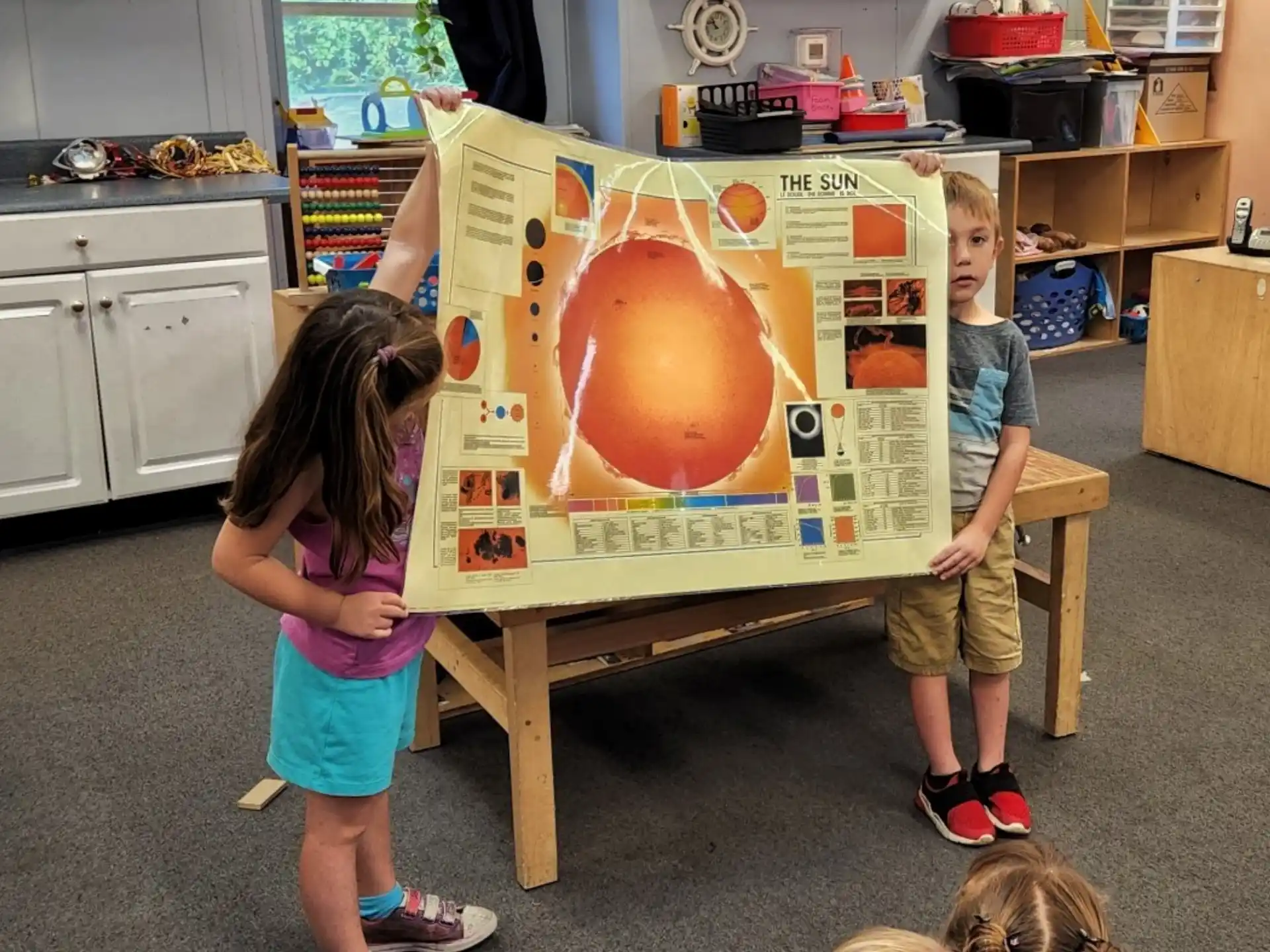 a couple of kids playing with a board game